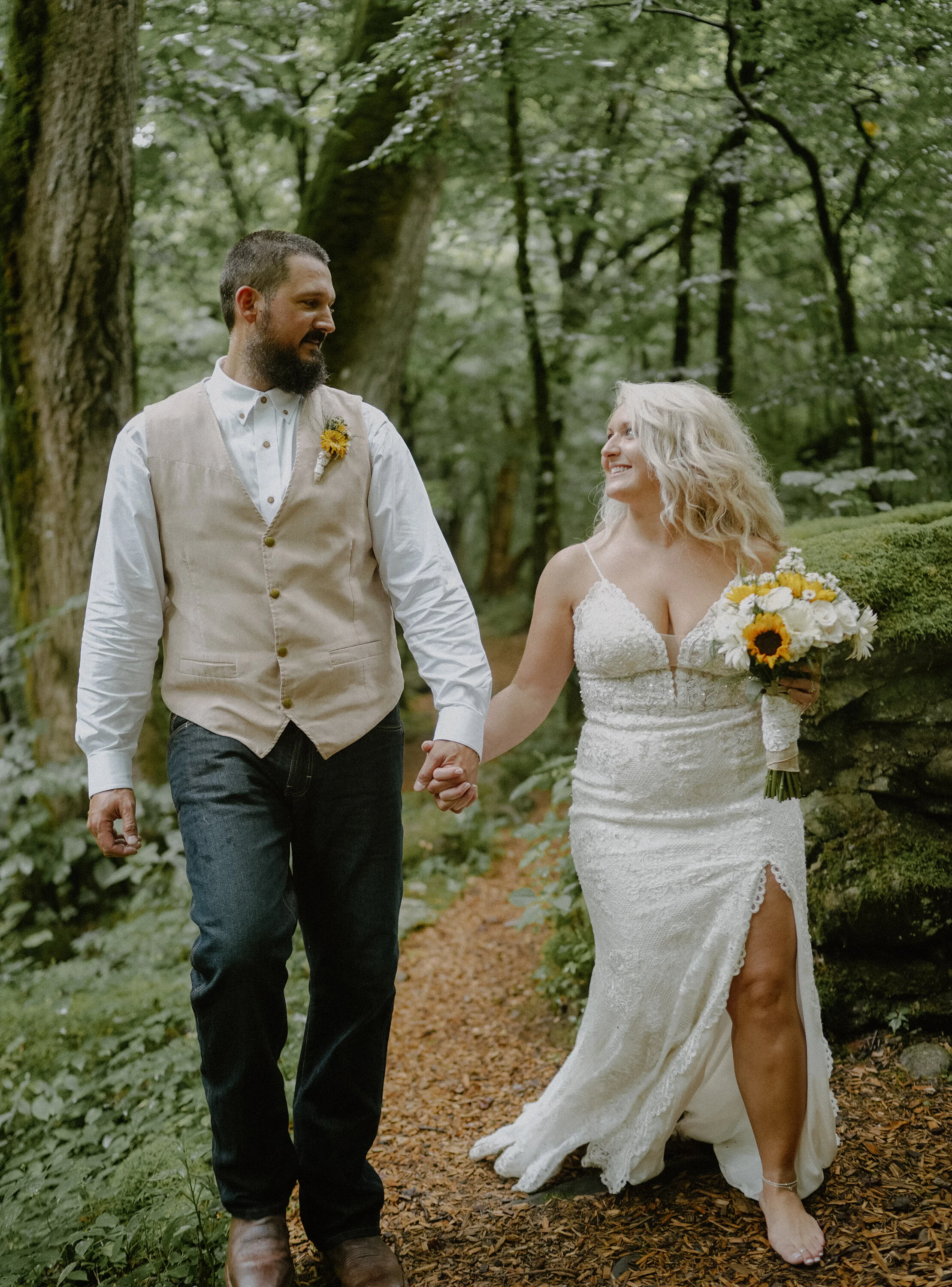 Ely's-mill-elopement-walking-in-woods.jpg
