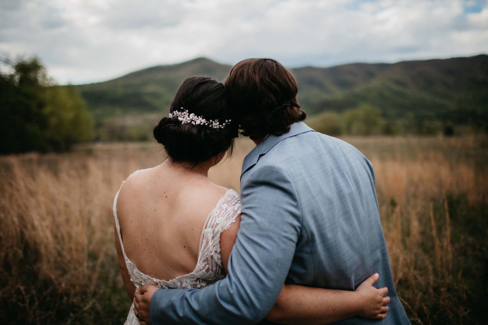 cades-cove-elopement-effortless-elopements-couple-looking-at-mountains.jpg
