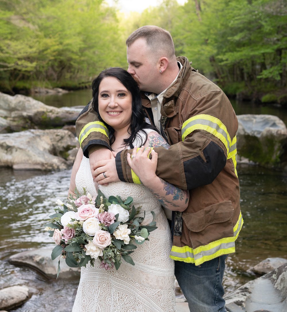 greenbrier-elopement-fireman-kissing-bride.jpg