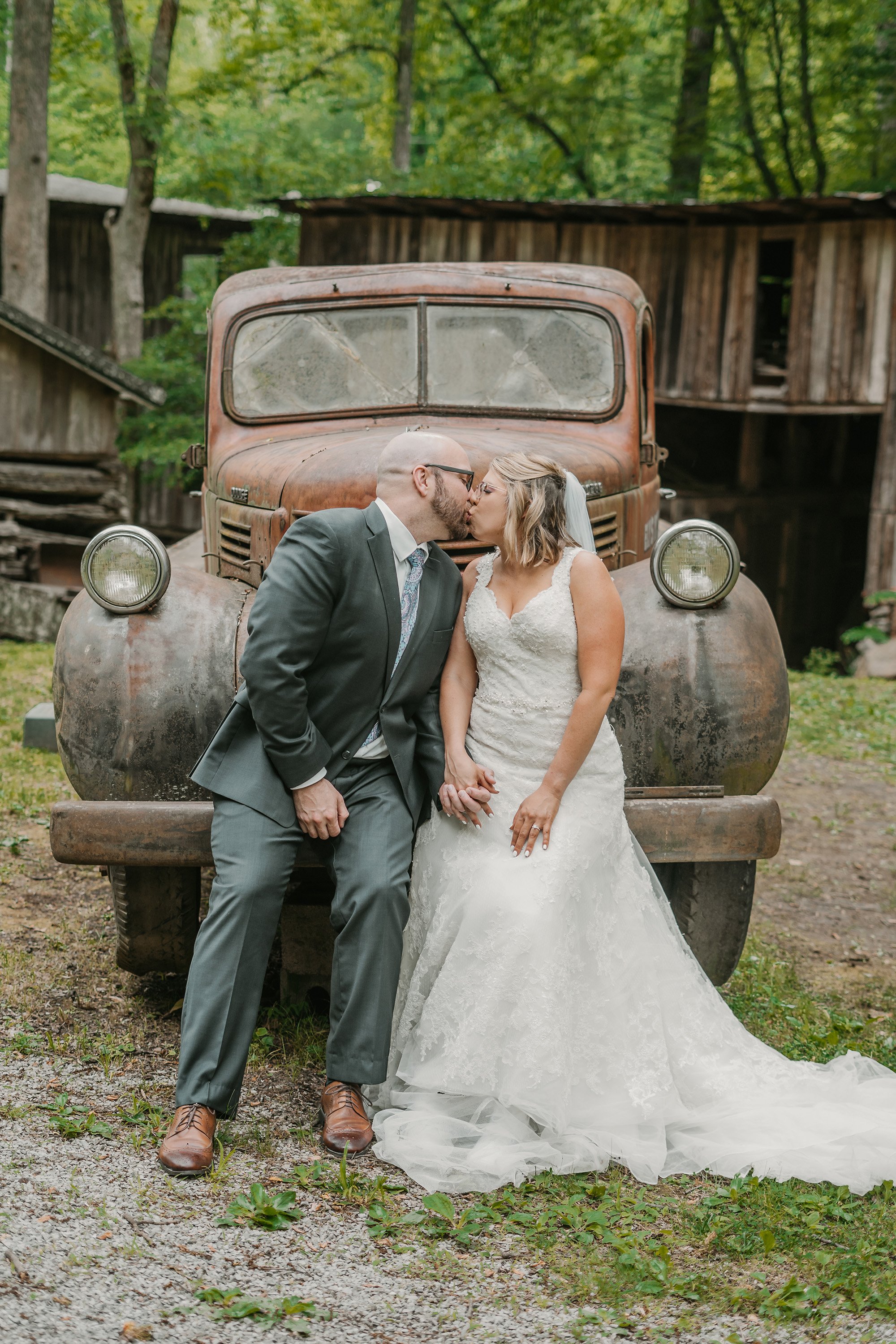elys-mill-elopement-rustic-truck-bride-and-groom-kiss.jpg