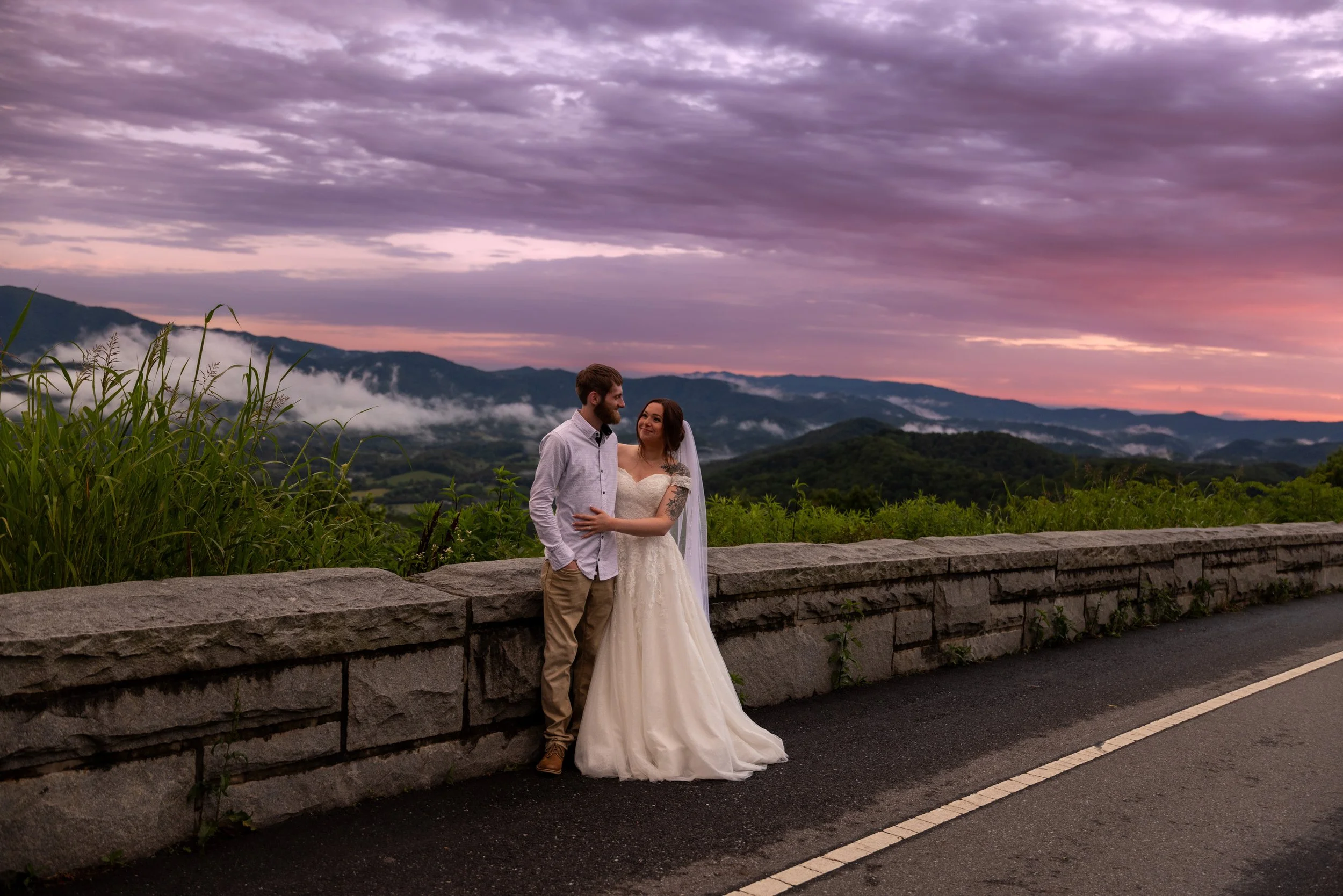Couple eloping in Gatlinburg Tennessee on the foothills parkway at sunset