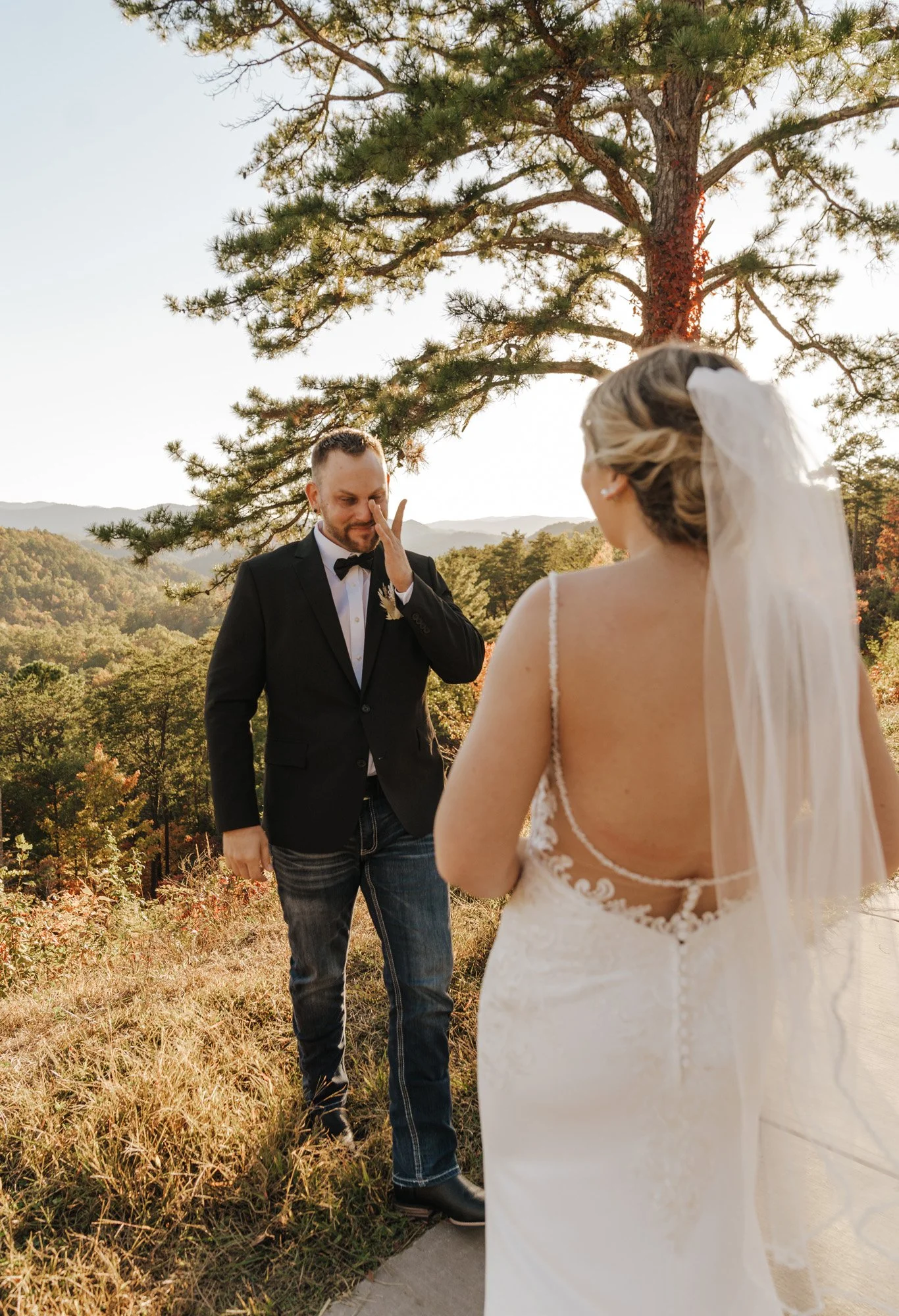 Crying groom first look on the foothills parkway