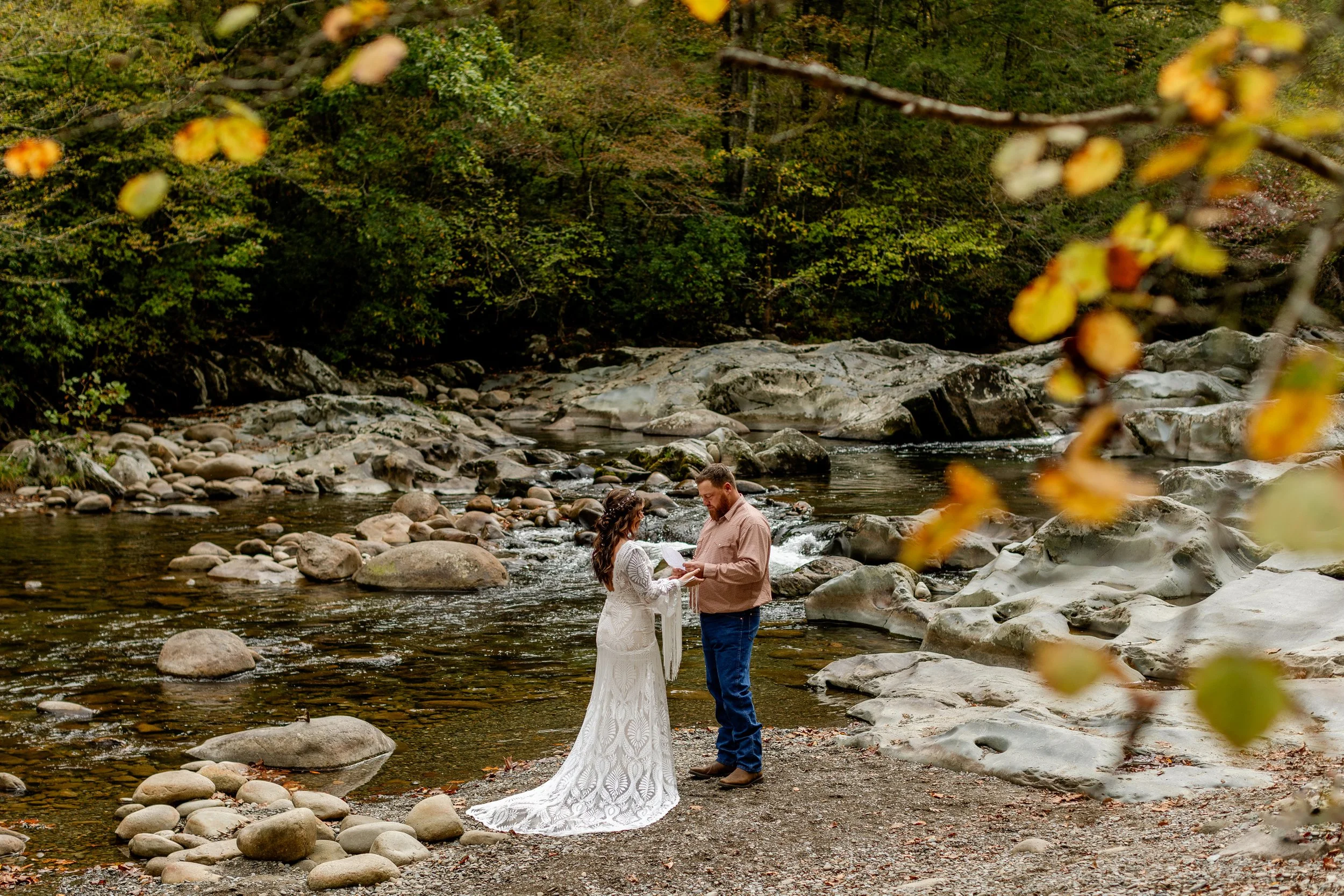 Couple getting married by rushing water in Greenbrier
