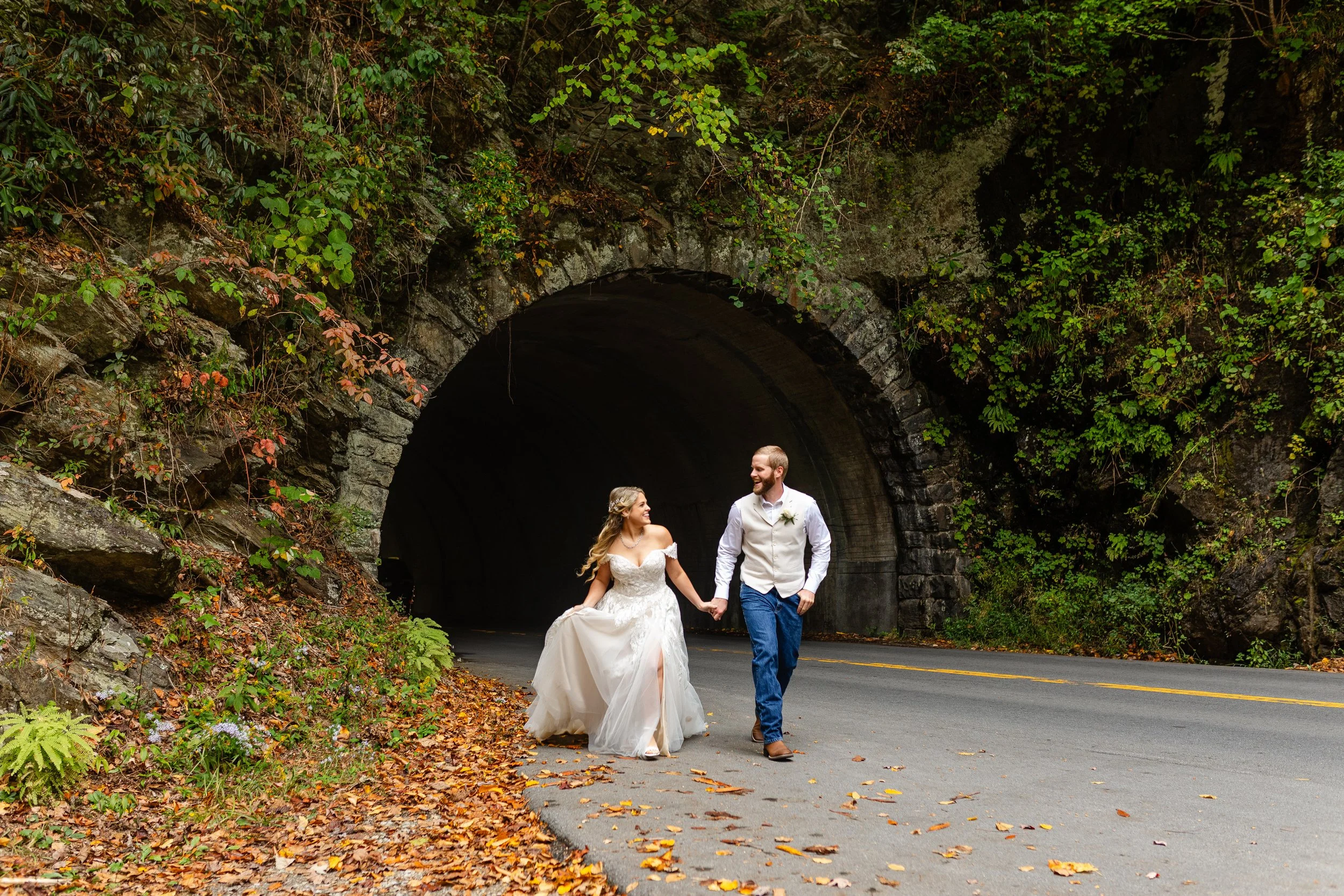 Bride and Groom running through Tunnel in Cades Cove