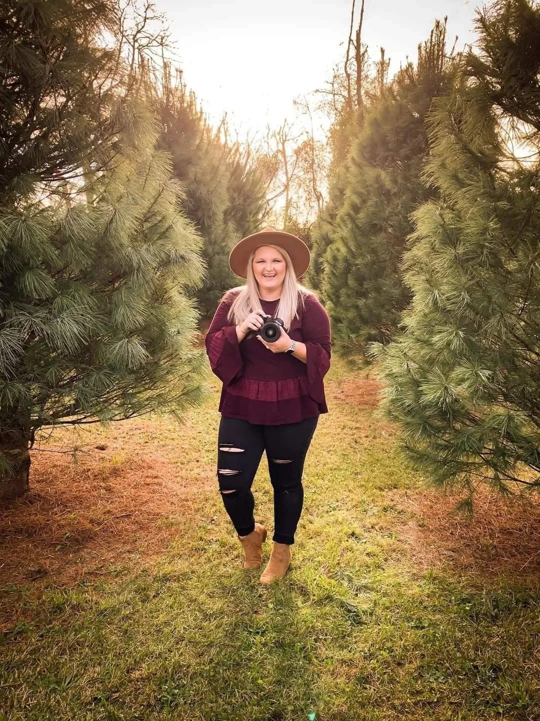 Full body picture of photographer with camera