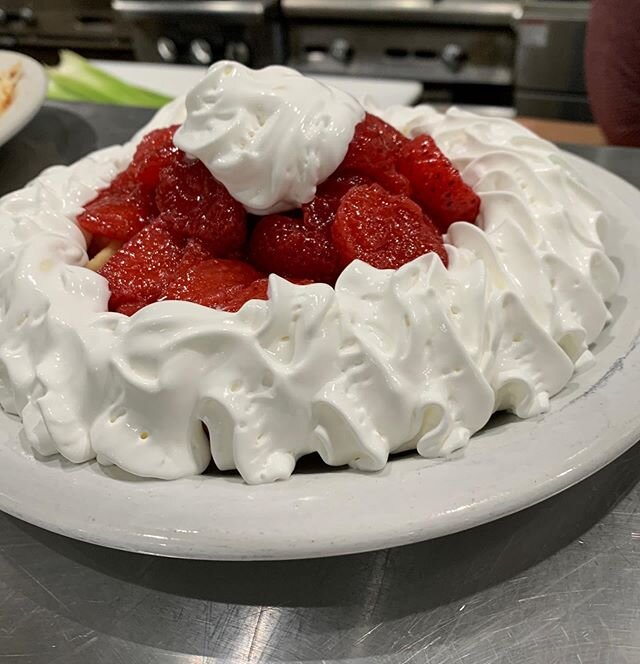 Belgian waffle loaded with strawberries and whipped cream 🤤