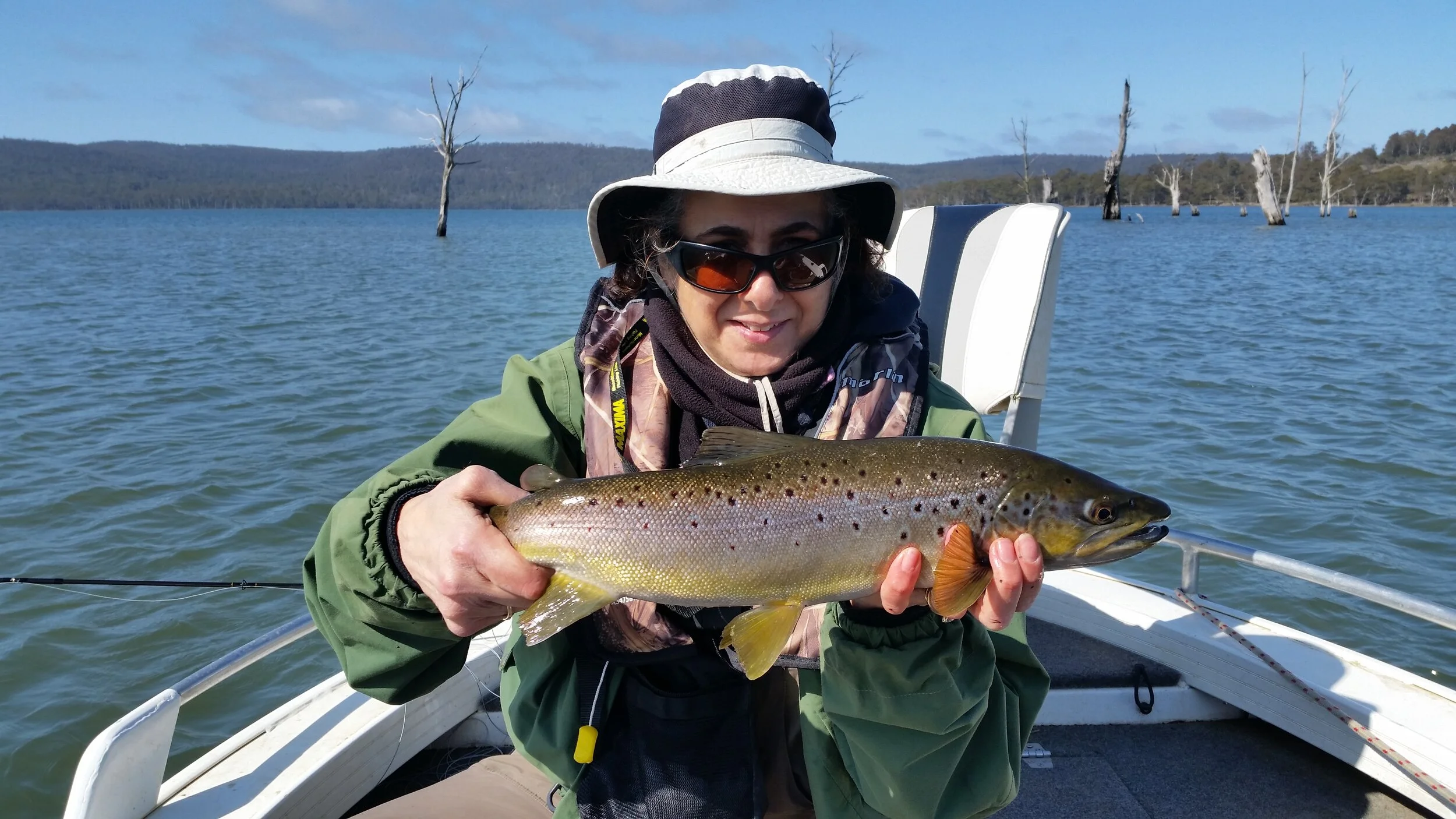 Anna with a really well conditioned Woods Lake brown trout taken on fly last weekend.