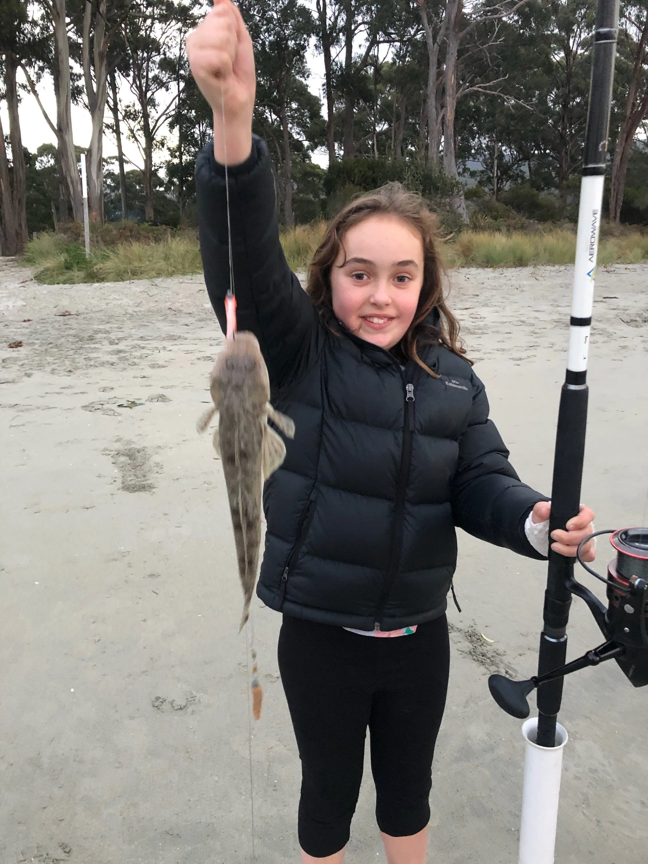 Keen young fisher Taylor with a surf caught sand flathead last weekend ………