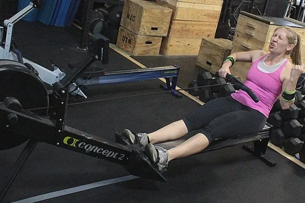 Cassi getting her jam on while rowing...