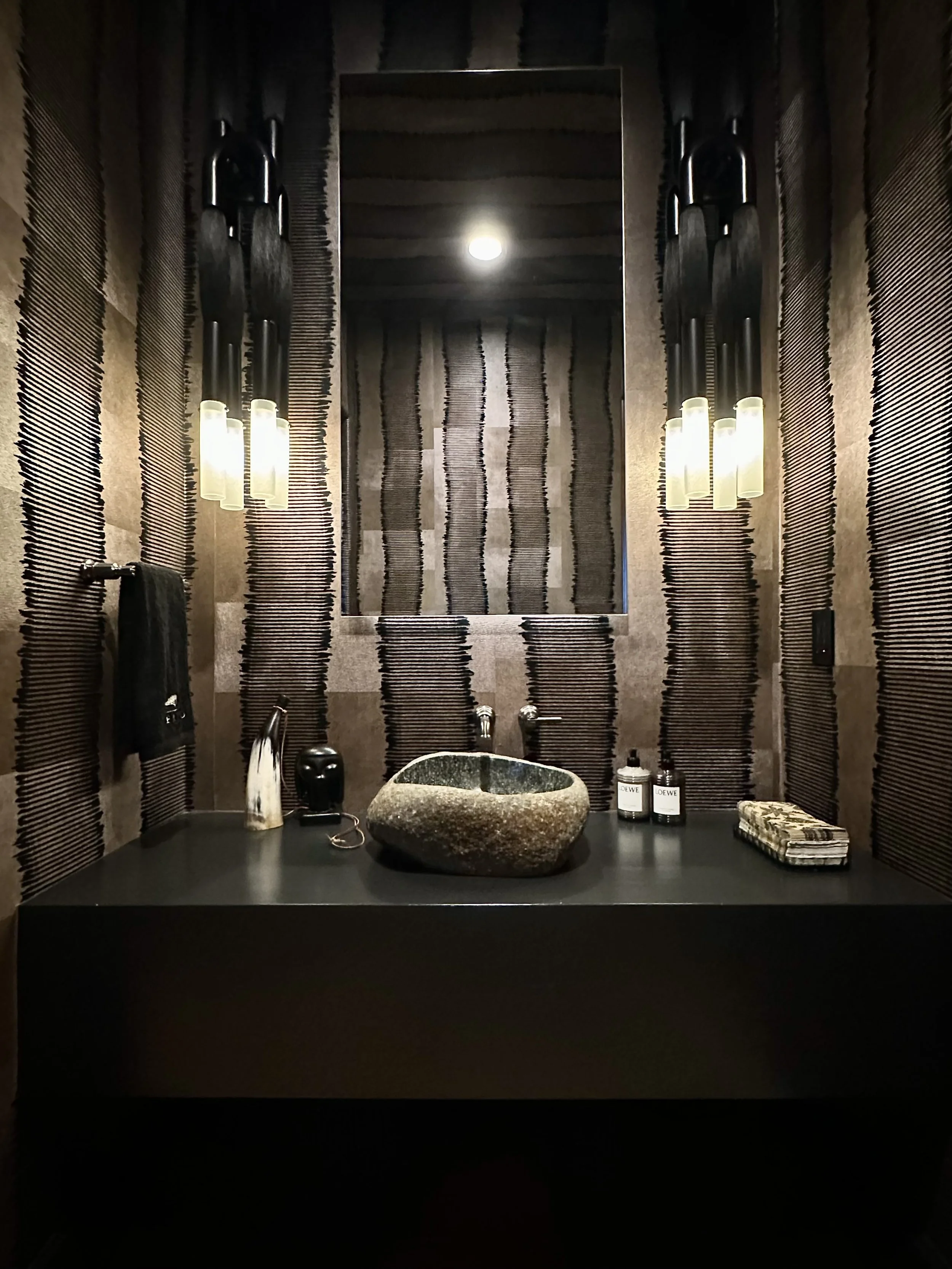 Safari Inspired Moody Bathroom Design with Bold Wallpaper and Rich Textures 