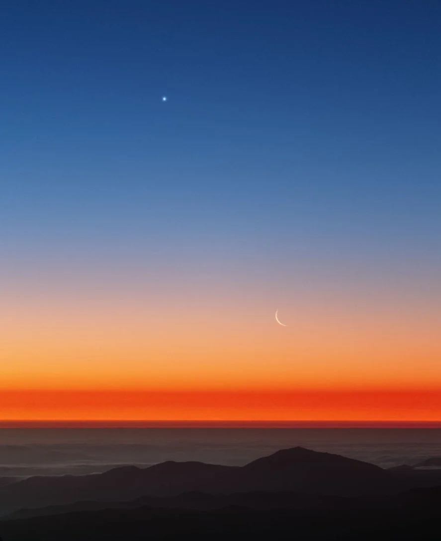 Sun rising over the horizon