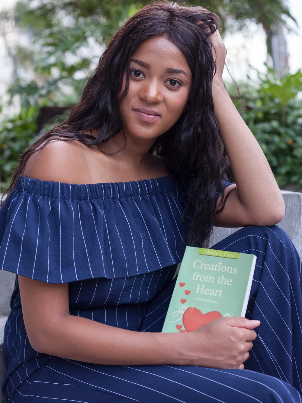portrait-of-a-beautiful-woman-holding-a-book-mockup-while-at-a-park-a17334.jpg