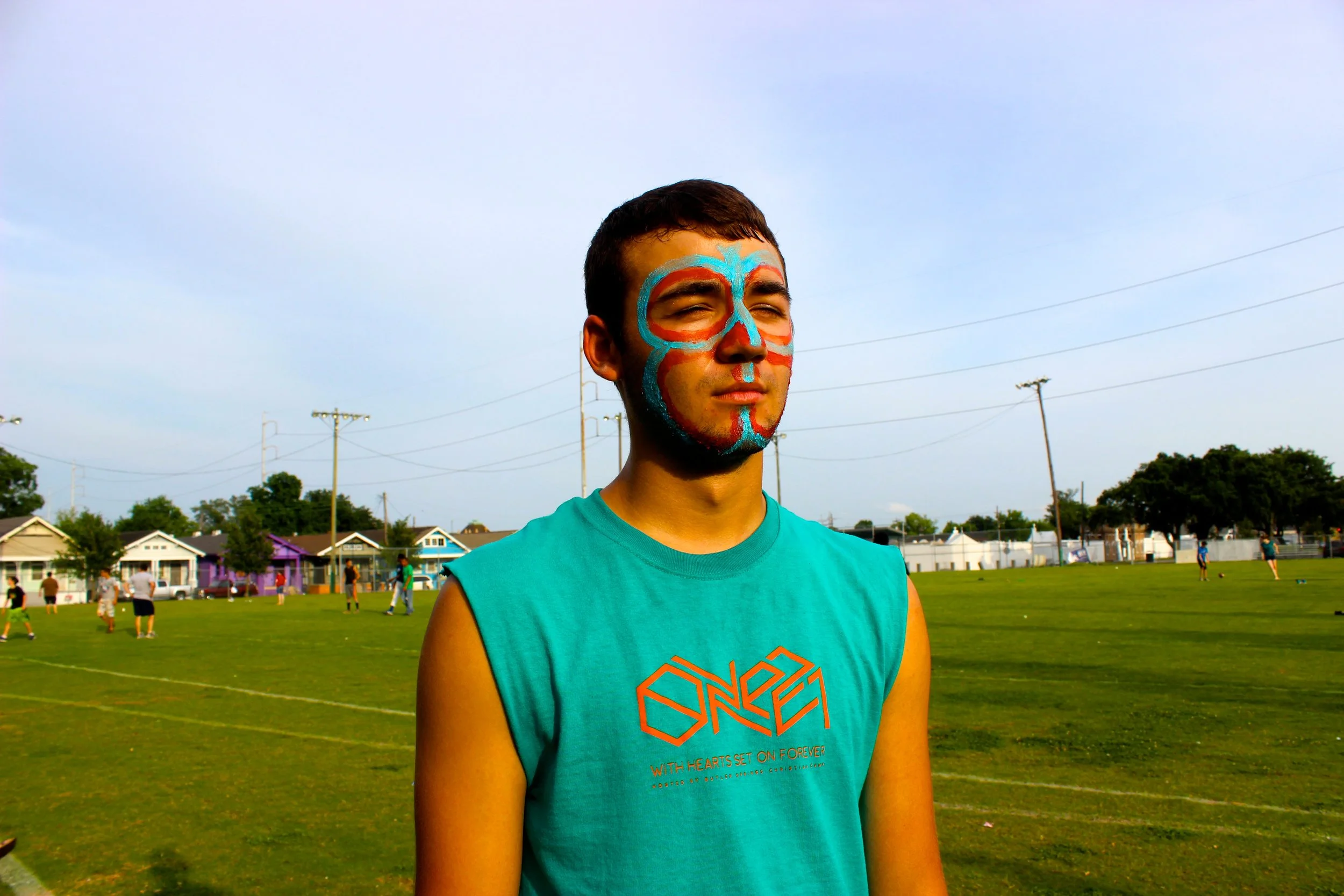 Young man in New Orleans with face paint