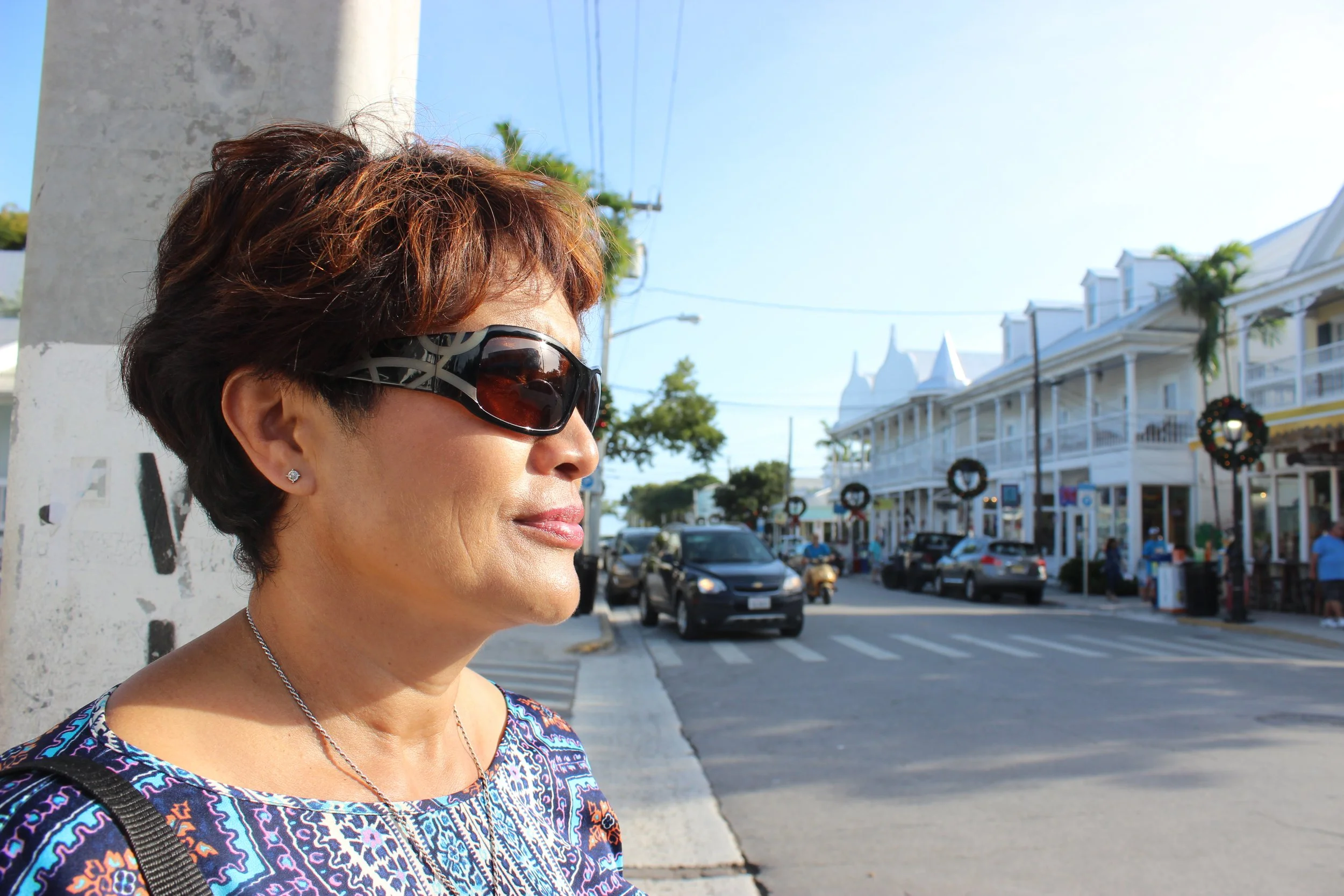 Woman looking out onto the street in Key West, Fla.