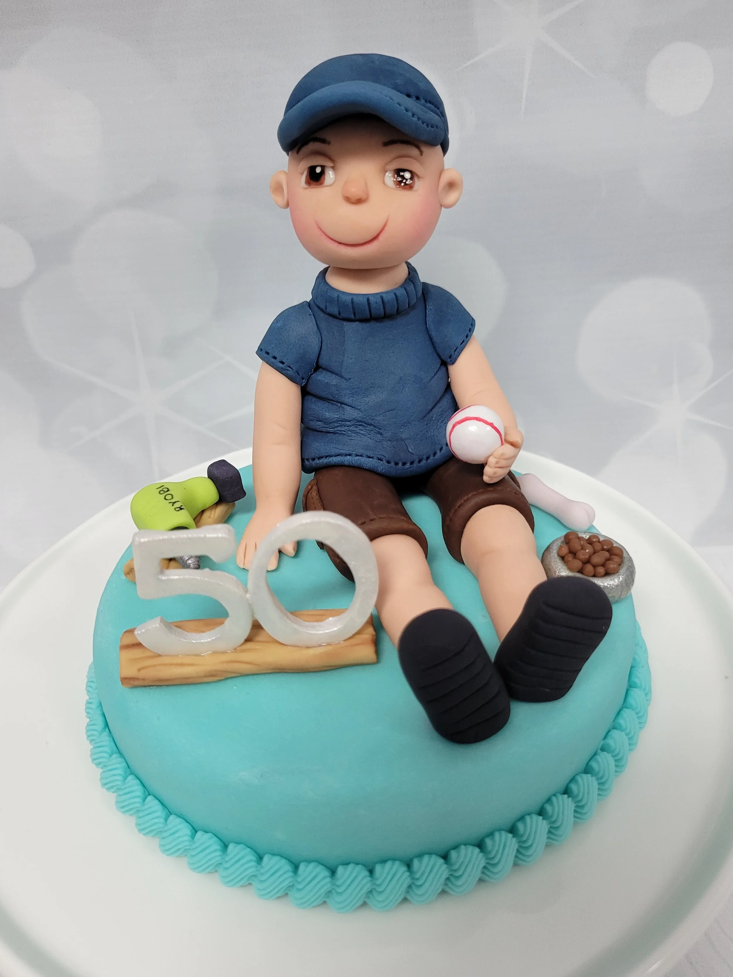Construction worker cake topper for a guy who loves baseball and dogs