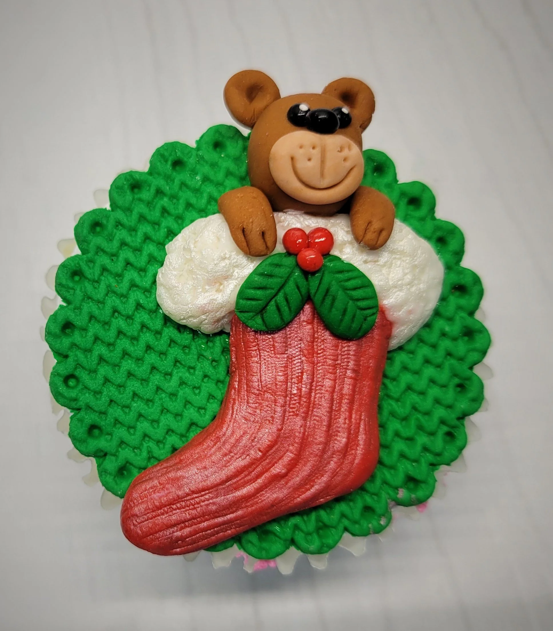 Teddy bear in stocking cupcake topper