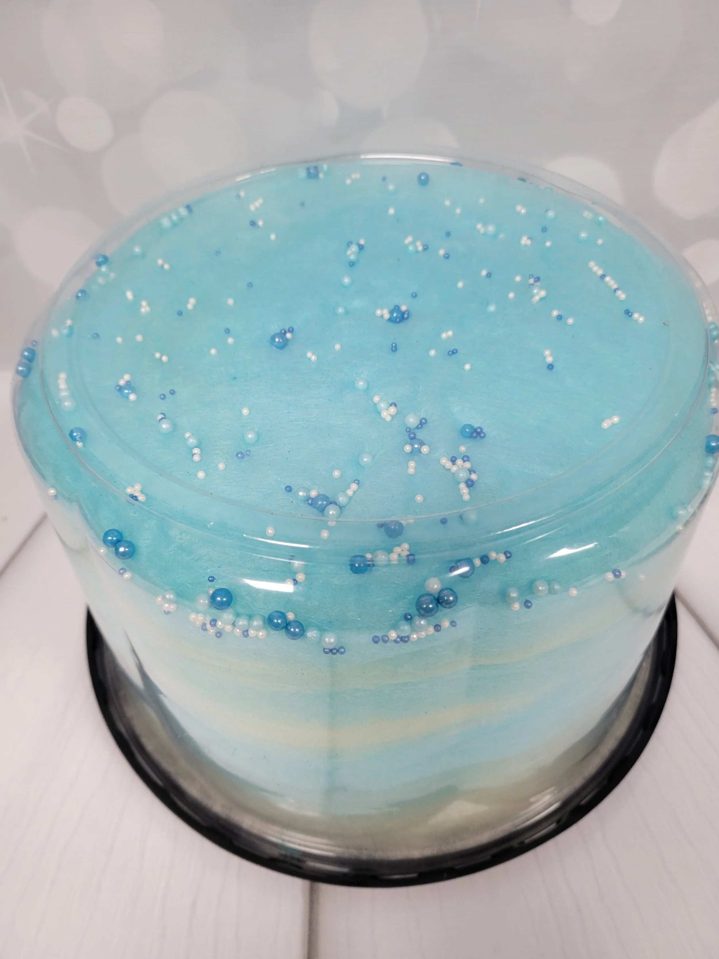 Cotton candy cake with sprinkles.  Vanilla and Blue Raspberry