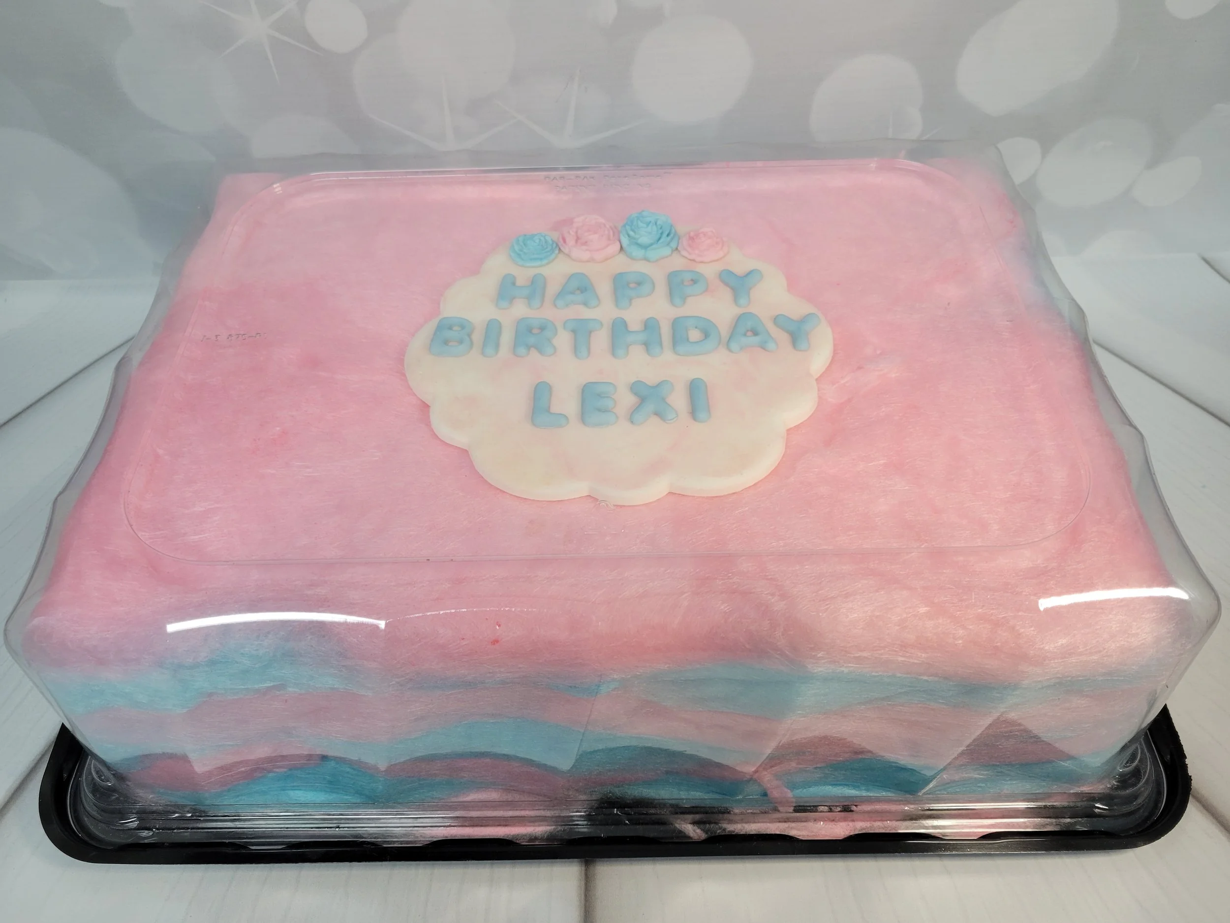 Cotton candy birthday cake with plaque