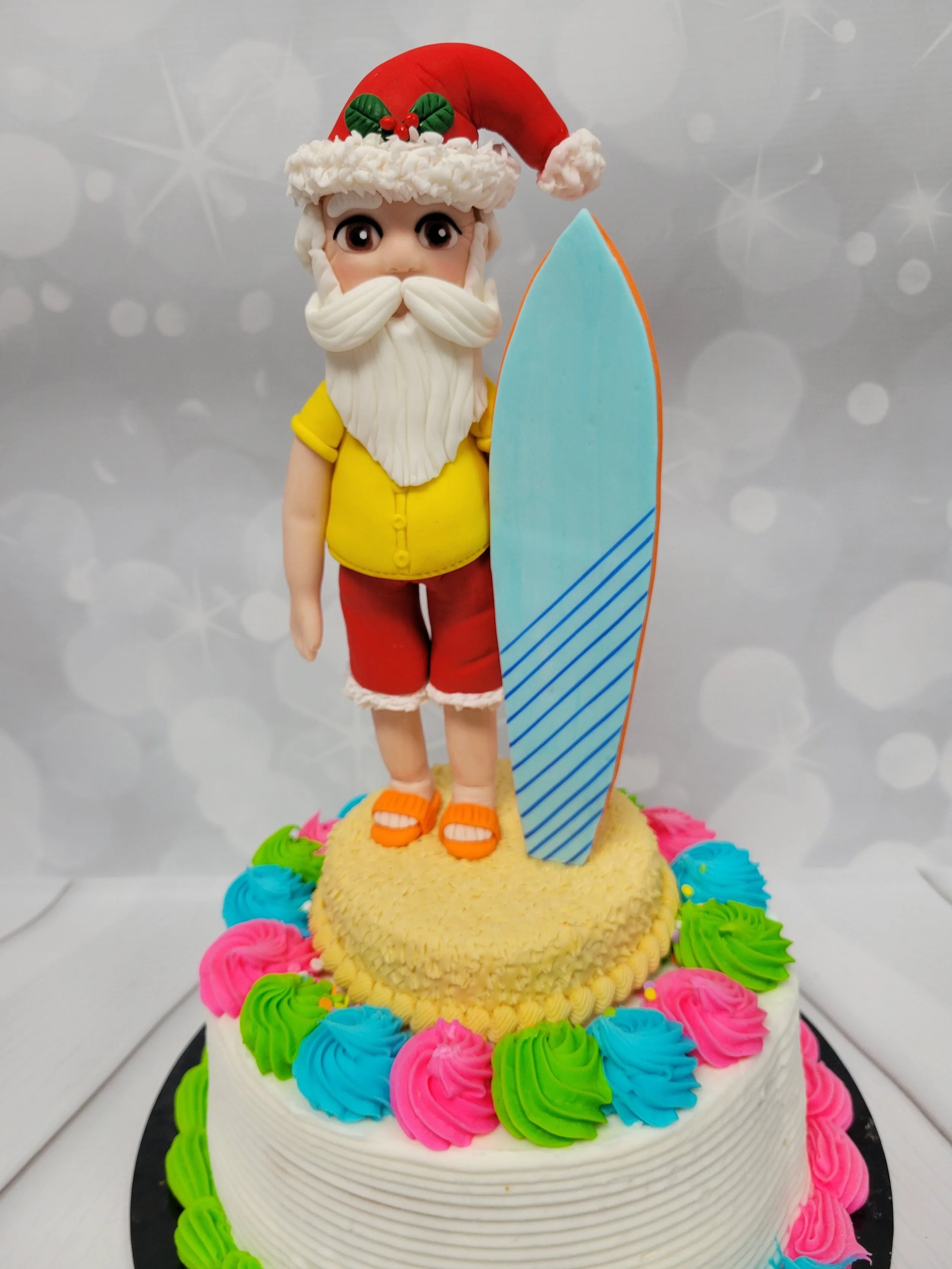 Tropical Santa with a surfboard - on a cake