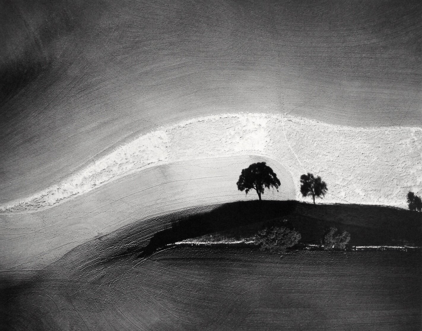 William Garnett  “Two Trees on Hill with Shadows, Paso Robles, CA, 1974”  8”x10” silver gelatin print  Signed in pencil on recto. Stamped, titled, dated on verso.