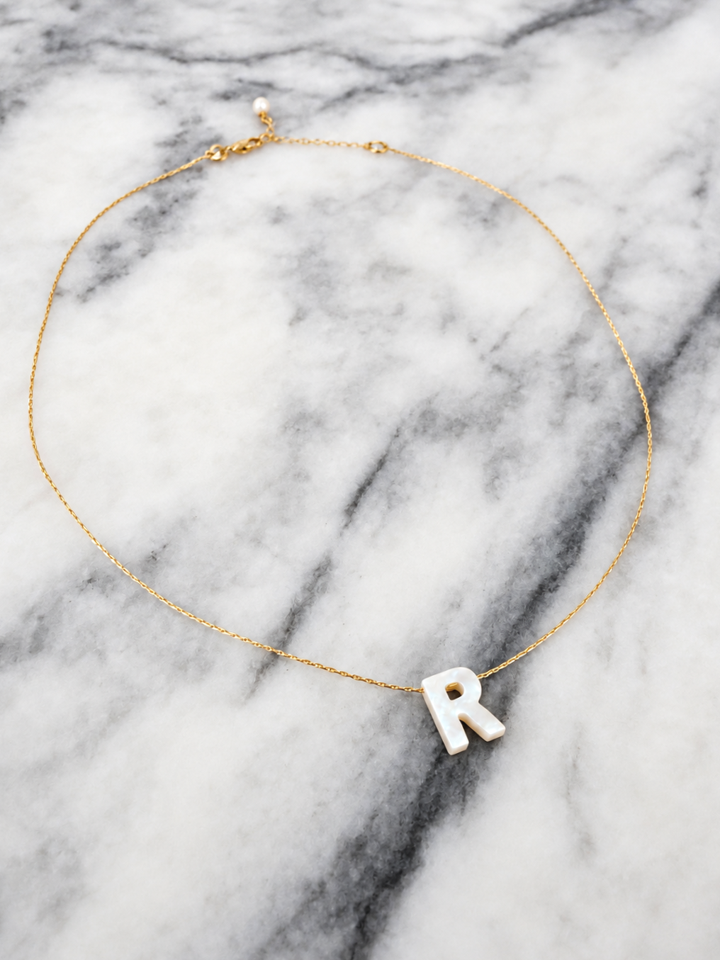 Gold+Chain+with+Mother-of-Pearl+R+Pendant.png