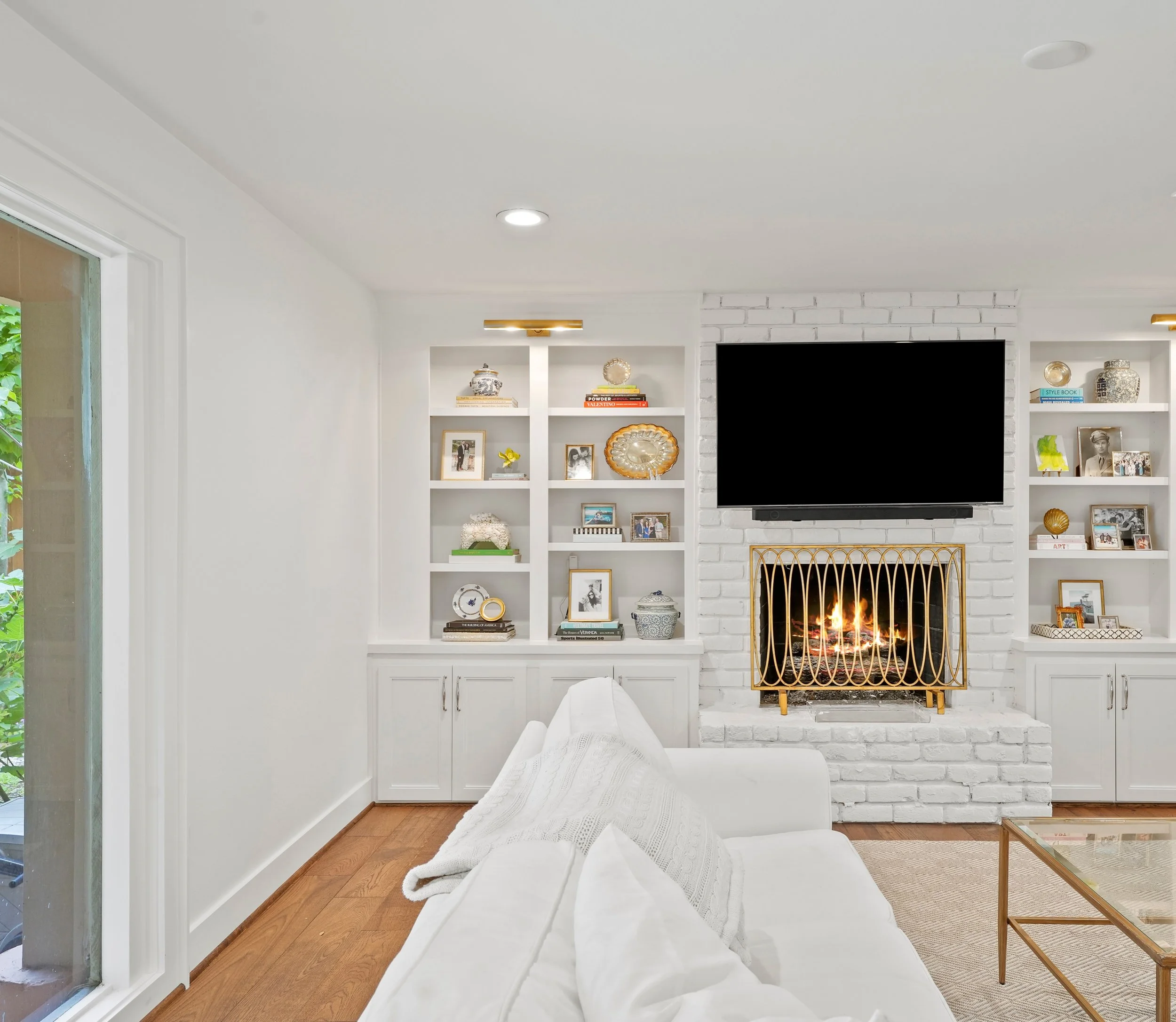 What a difference 😍 

A little masonry, carpentry and a lot of white paint brought this fireplace and built-in cabinets back to life! 

Hamblin &amp; Haines Homes 

Dallas remodeler | Living room before and after | Dallas builder | DFW remodeling | 