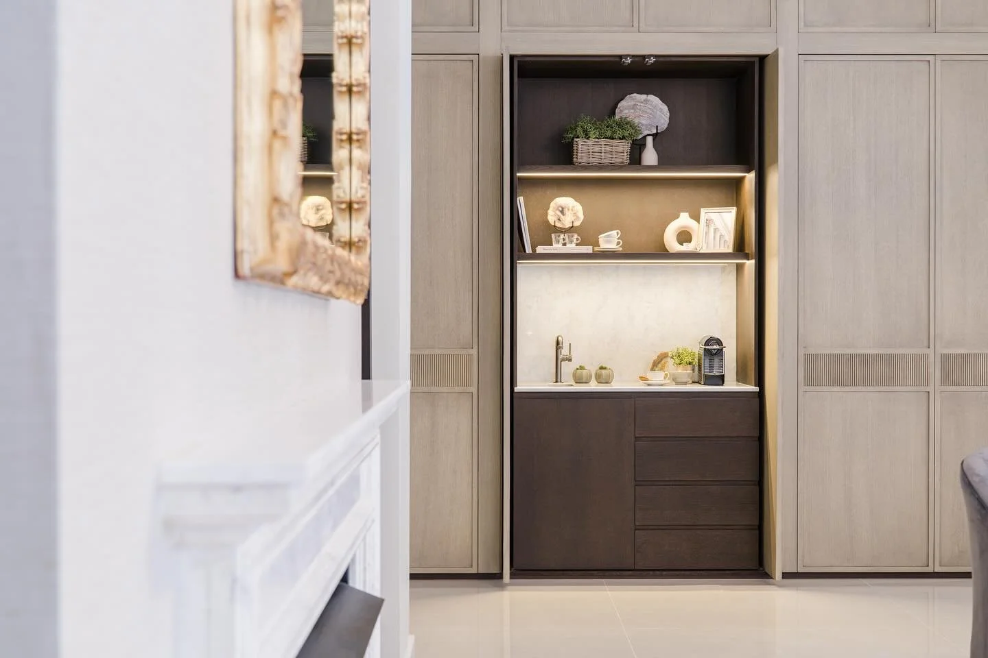 The concealed coffee station in one of our projects where modern elegance meets timeless charm. The harmonious color &amp; material palettes create an atmosphere that whispers luxury in every single detail. 
منطقة ركن القهوه في أحد مشاريعنا،،حيث يجسد