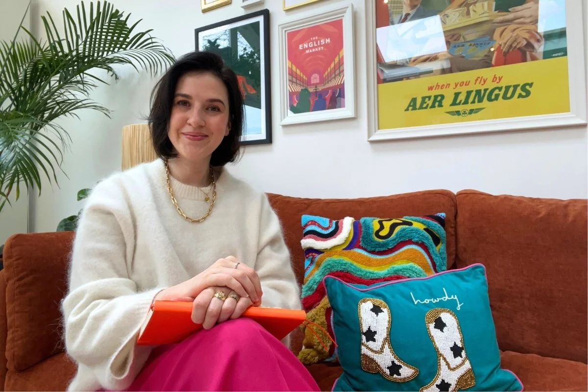 Photo of woman on orange couch
