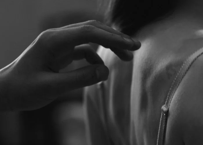 Geometric drawing of an outline square with sections divided by vertical, horizontal, and half circle lines.