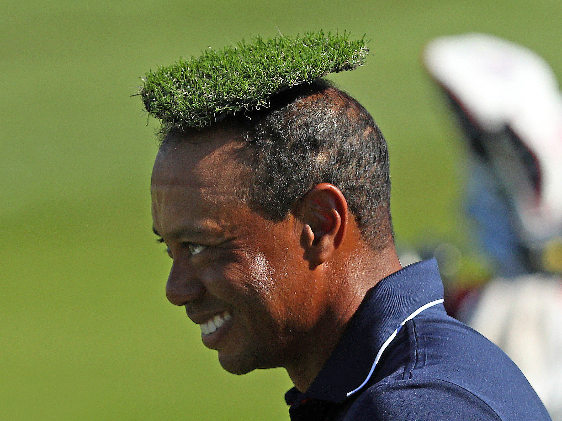  Tiger Woods has a piece of artificial grass placed on his head by Justin Thomas during a practice round for the Ryder Cup at Le Golf National, Paris.
Photo by Marc Aspland, 27 September 2018
 
