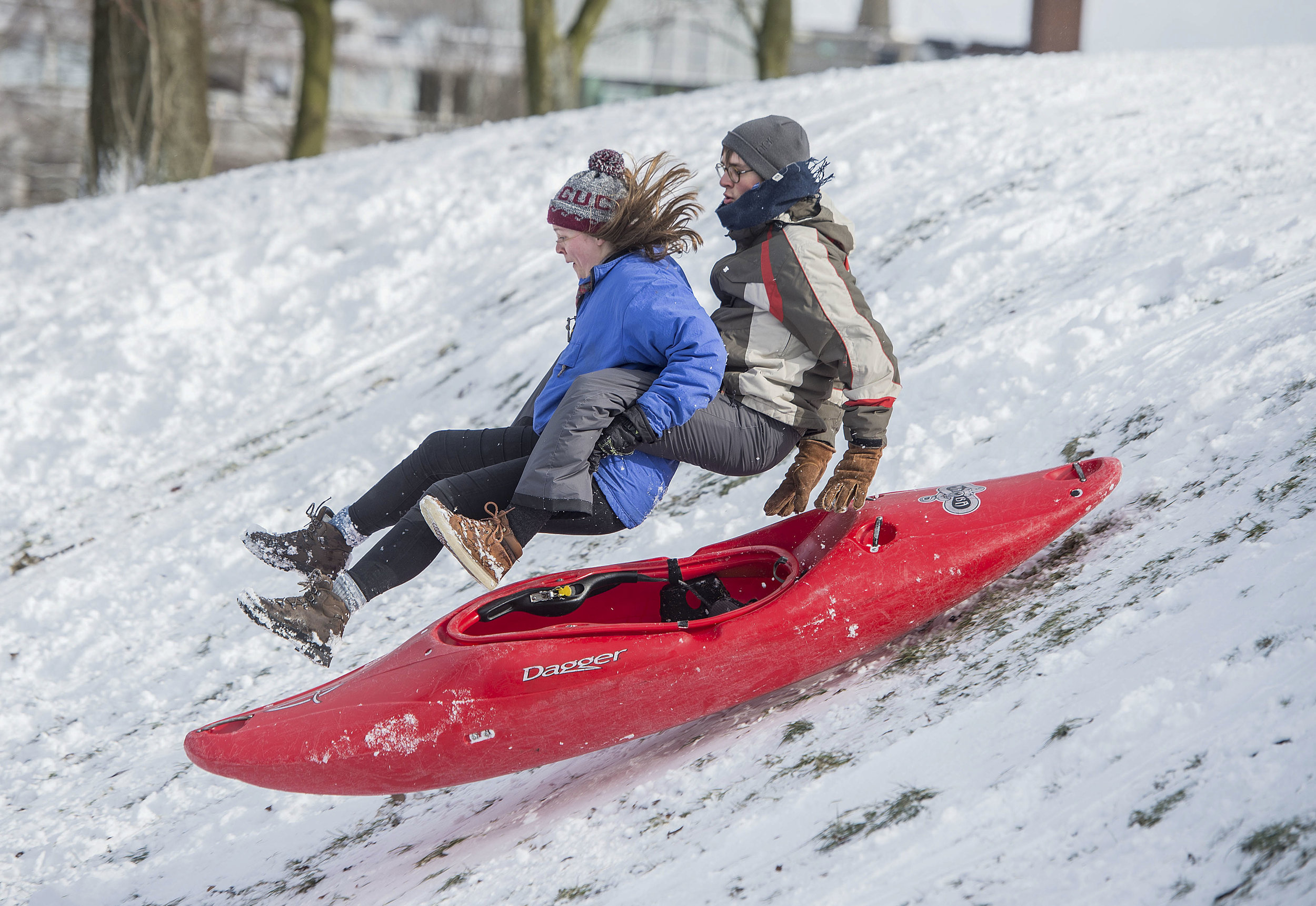  Members from the Glasgow University Canoe Club try an alternative way to get down a snowy hill in Kelvingrove Park, Glasgow during the snowstorm dubbed "The Beast from the East�.
Photo by Wattie Cheung, 28 February 2018
 