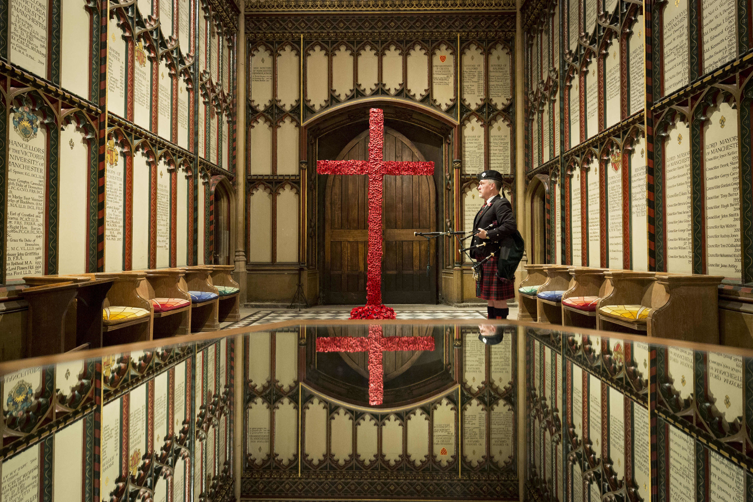  At Manchester Cathedral Neil Macdonald is one of more than 1,000 lone pipers around the world to play he traditional Scottish lament, Battle O'er, at 6am to herald the start of Armistice Day.
Photo by Chris Bull, 11 November 2018
 