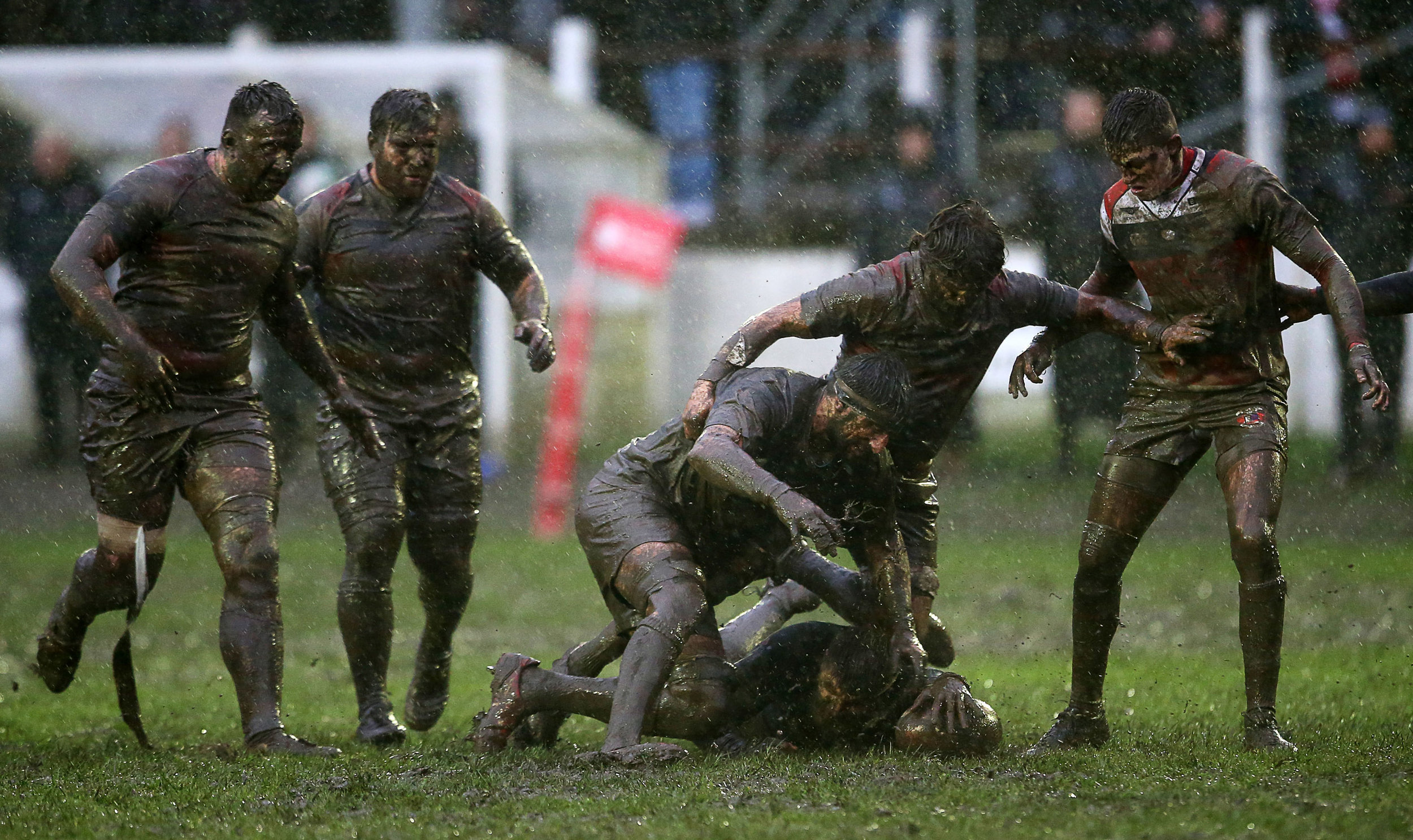  Players wrestle for the ball in muddy conditions during a WRU National Cup Rugby match between Cross Keys and Pontypool at Pandy Park, Swansea.
Photo by Chris Fairweather, 26 January 2019
 