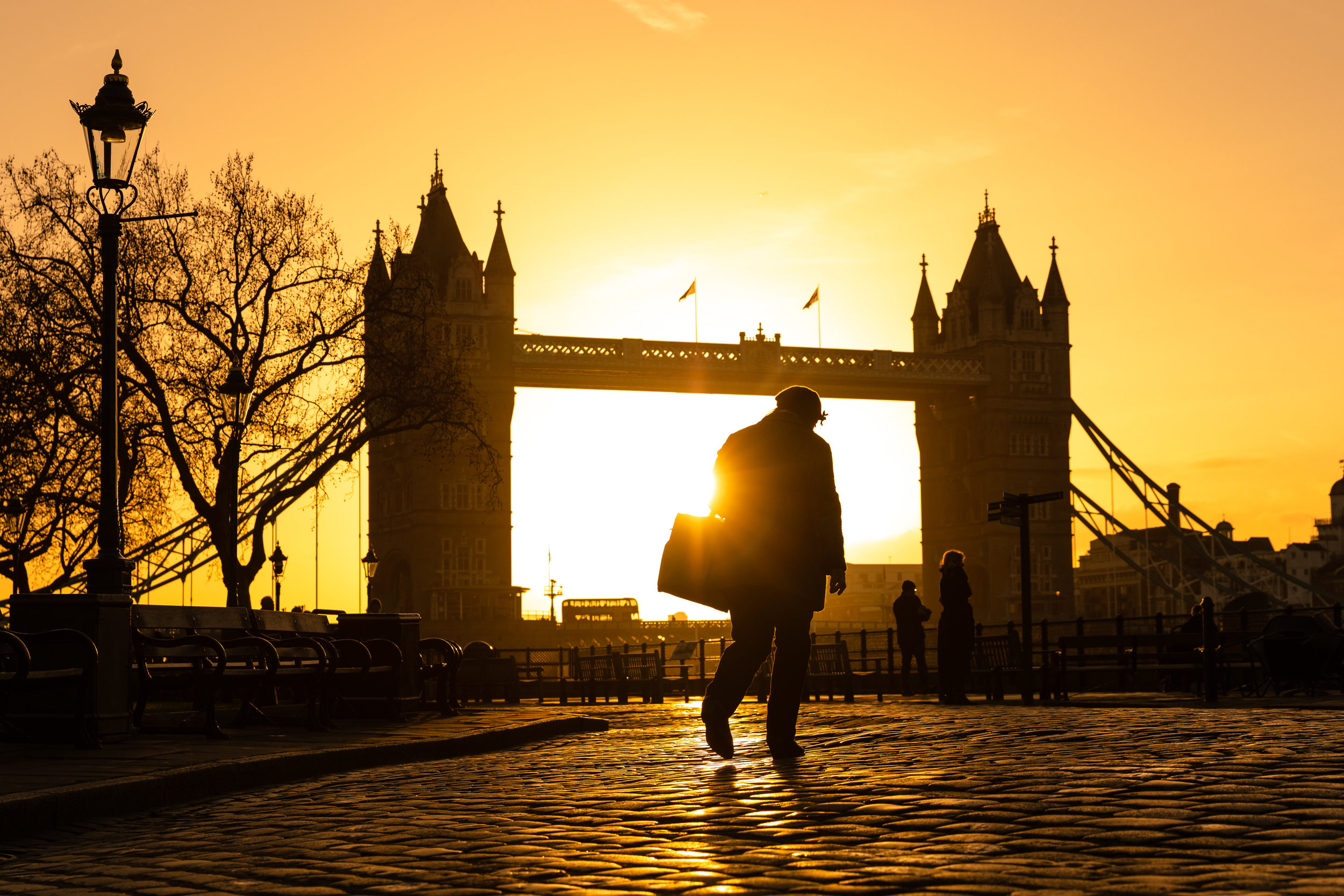  A person walks along the Thames path in front of Tower Bridge in London shortly after sunrise as the capital experiences unseasonally mild and sunny weather.
Photo by Vickie Flores, 22 December 2018
 