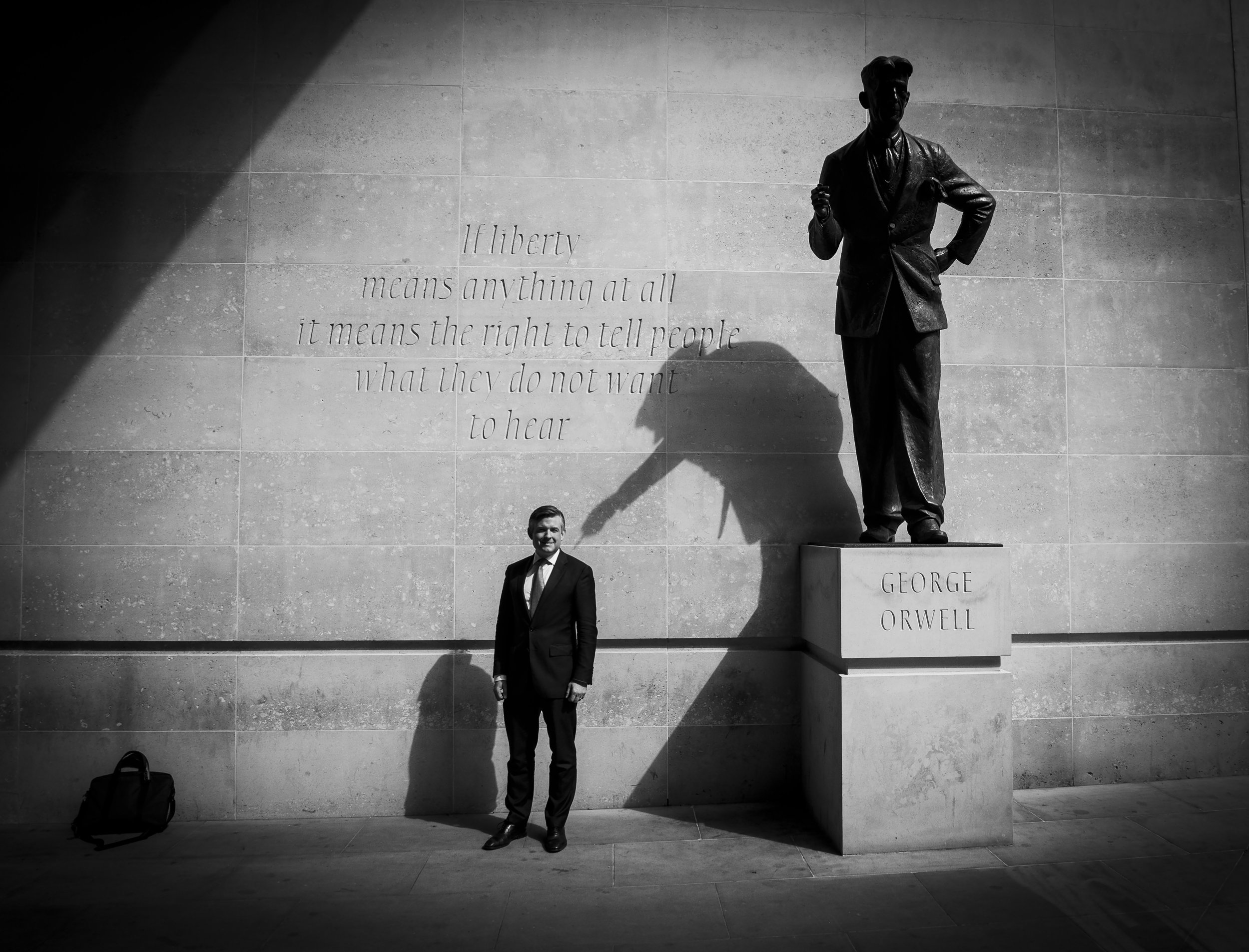  George Orwell�s shadow points at the Shadow Health & Social Care Secretary Jon Ashworth MP as he leaves New Broadcasting House after appearing on The Andrew Marr Show.
Photo by Elliott Franks, 27 May 2018
 