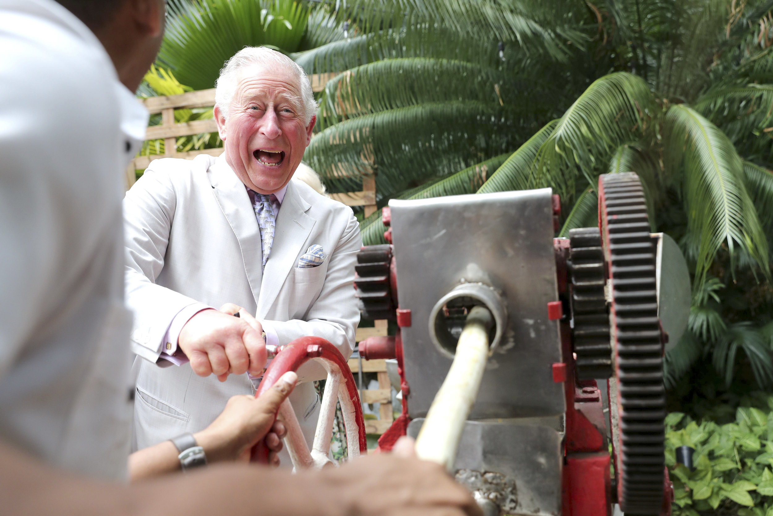  Prince Charles, Prince of Wales grinds sugar cane during a visit to Habanera, a privately owned restaurant in Havana, Cuba. Their Royal Highnesses have made history by becoming the first members of the royal family to visit Cuba in an official capac