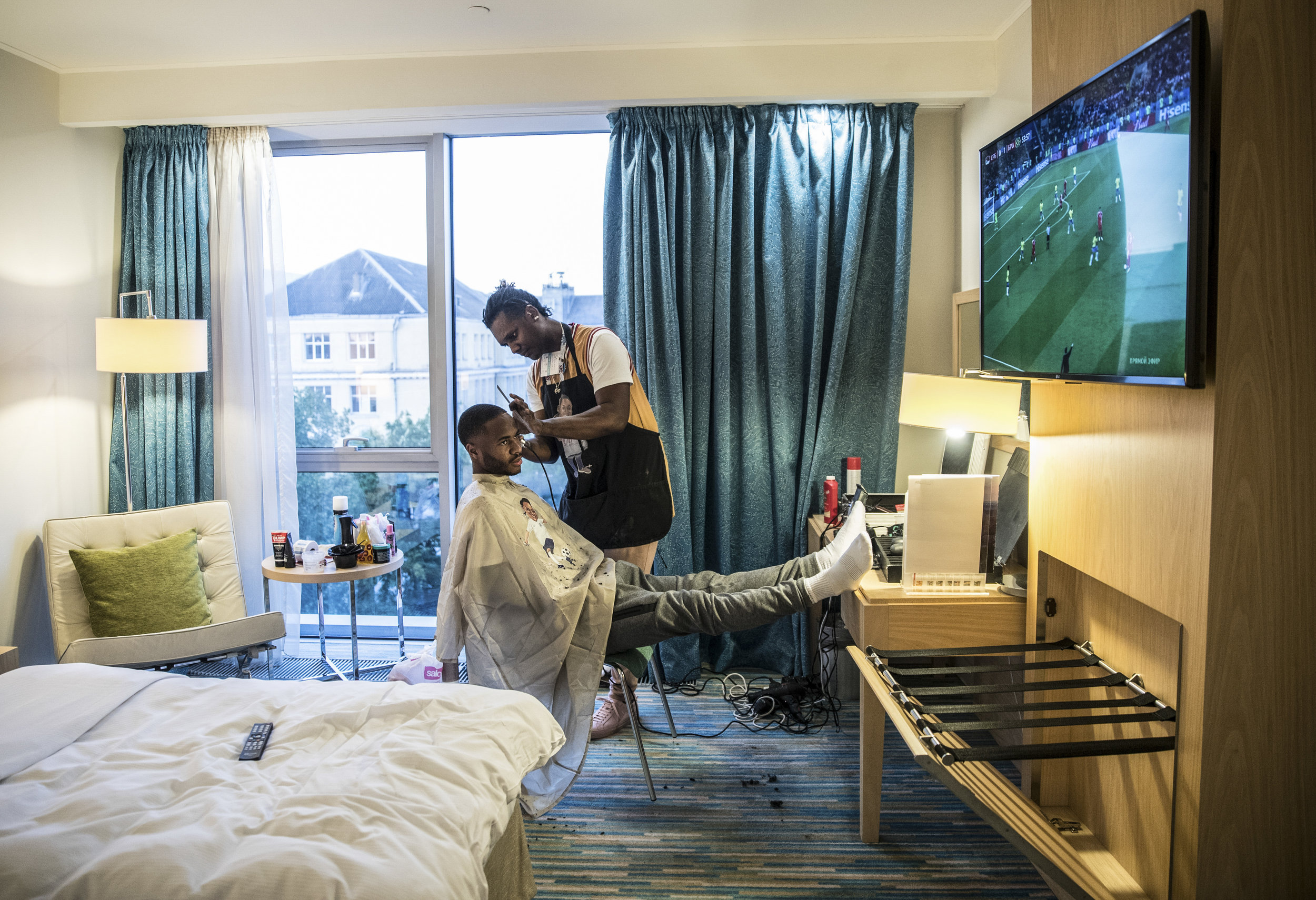  Raheem Sterling gets his hair cut in his hotel room before England�s World Cup game against Belgium in Kaliningrad, Russia.
Photo by Eddie Keogh, 27 June 2018
 