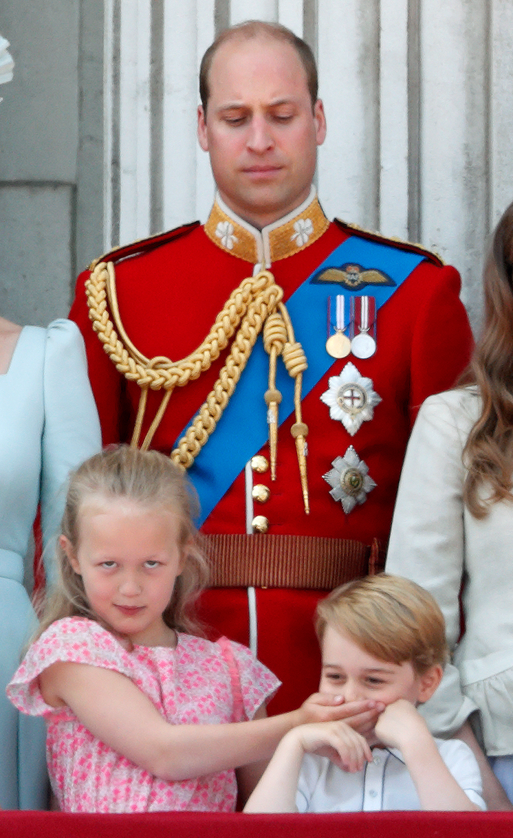  HRH Prince William, Duke of Cambridge looks on as Savannah Phillips puts her hand over Prince George of Cambridge's mouth whilst they stand on the balcony of Buckingham Palace during Trooping The Colour.
Photo by Max Mumby, 09 June 2018
 