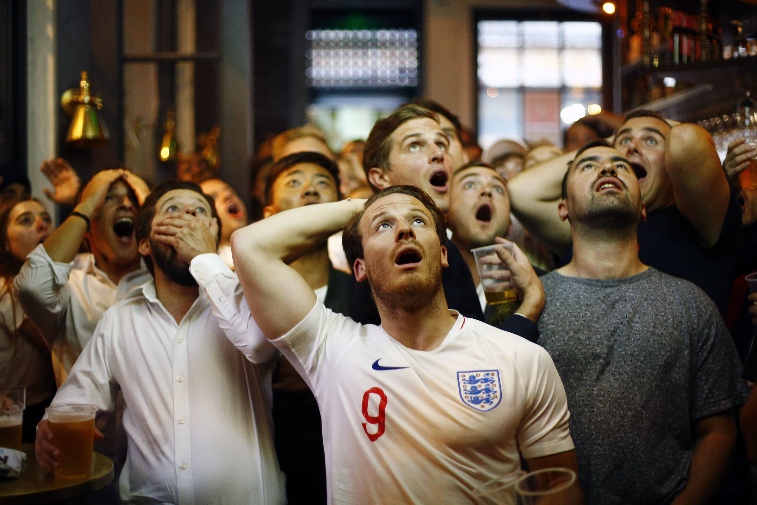  England fans watch the Croatia v England World Cup semi-final in a pub near Trafalgar Square, London.
Photo by Henry Nicholls, 11 July 2018
 
