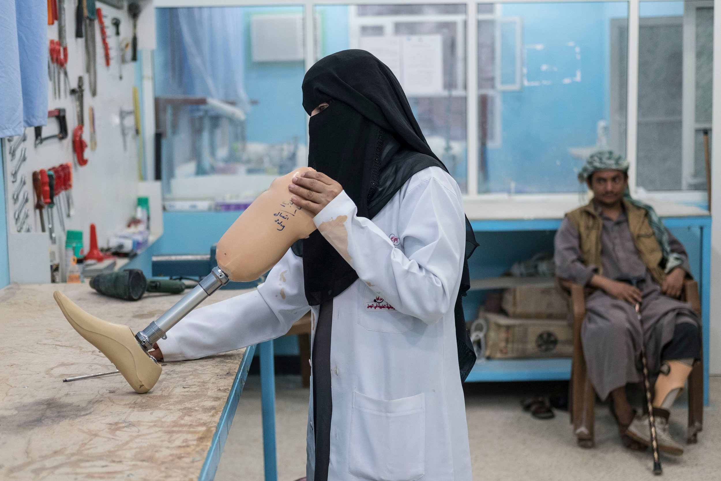  Fayda Ali Ali, a nurse trained in prosthetics adjusts a limb in the orthopaedic ward of a hospital in the government held town of Marib, over 100 miles from the county's capital Sanaa which is in the hands of the Houthi rebels.
Photo by Heathcliff O