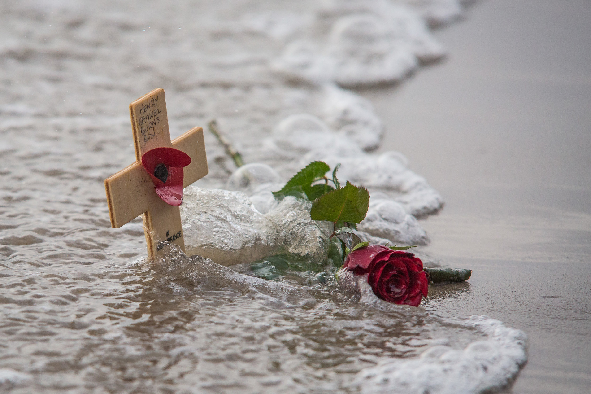  A Remembrance Cross and single red rose are washed by the seas at Sunny Sands beach in Folkestone on the 100th anniversary of The Armistice that ended the First World War.
Photo by Manu Palomeque, 11 November 2018
 
