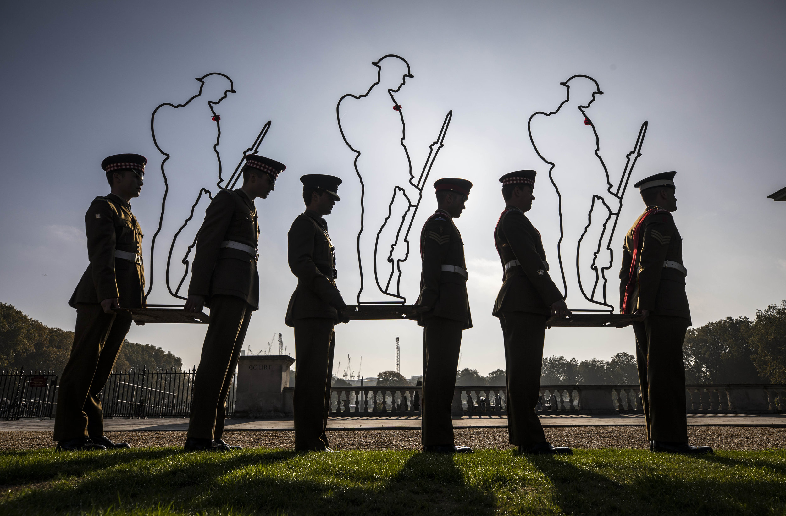  Guardsmen carry some of the "There but not there" World War One silhouettes which are to be placed in the grounds of the Royal Hospital in Chelsea to mark the centenary of the Armistice.

Photo by Richard Pohle, 16 October 2018
 