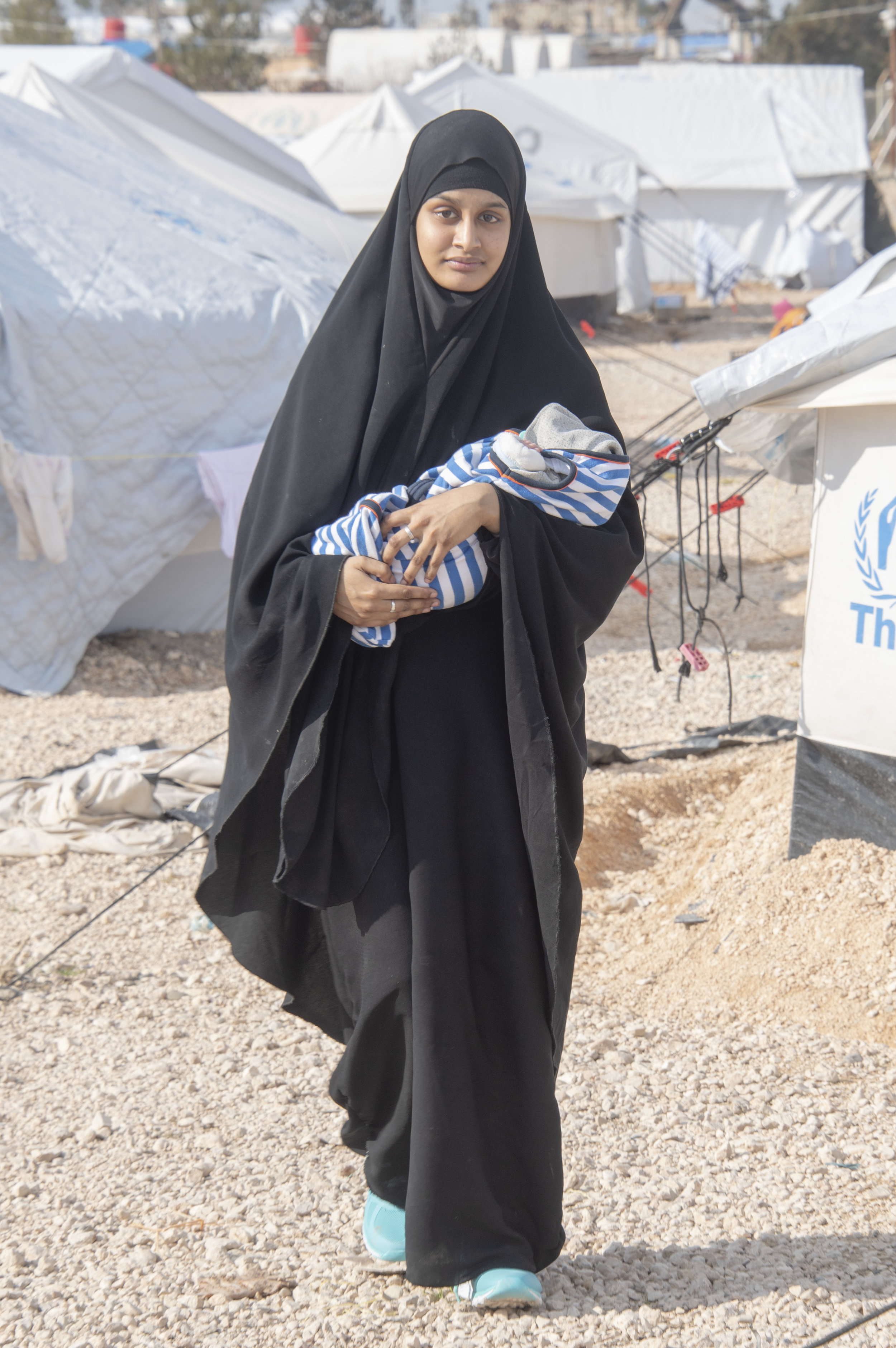  British Jihadi wife Shamima Begum pictured with her week old son Jerah (now deceased)  in Al Hawl camp for captured ISIS wives and children in Kurdish Syria.
Photo by Jamie Wiseman, 24 February 2019
 