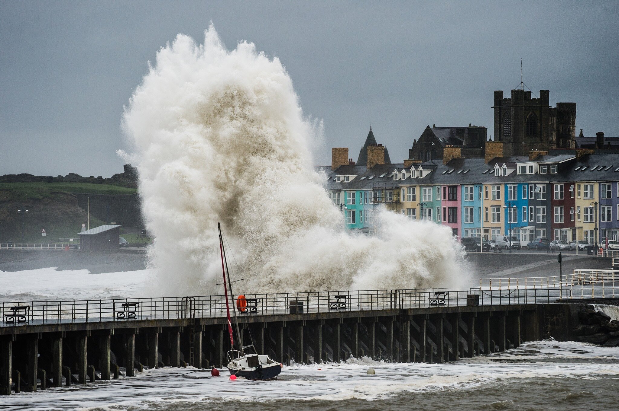UK Weather: Waves batter the seafront at Aberystwyth Wales