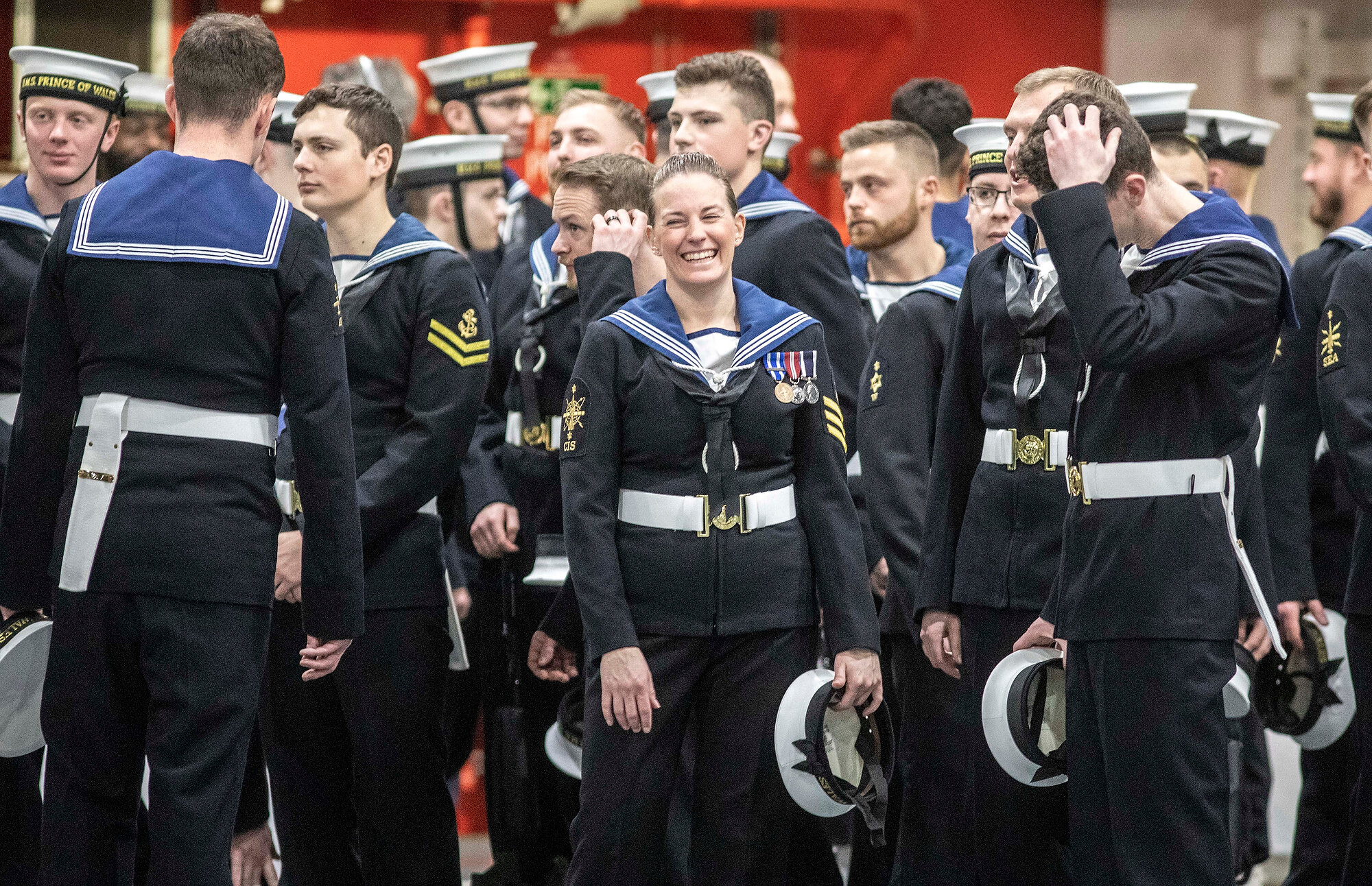  The honour guard of crew members of Britain's newest aircraft carrier HMS Prince of Wales prepare to go on parade for the ship's commissioning ceremony inside the giant hangar of the ship moored in Portsmouth. Photo: Richard Pohle/The Times, 10 Dece