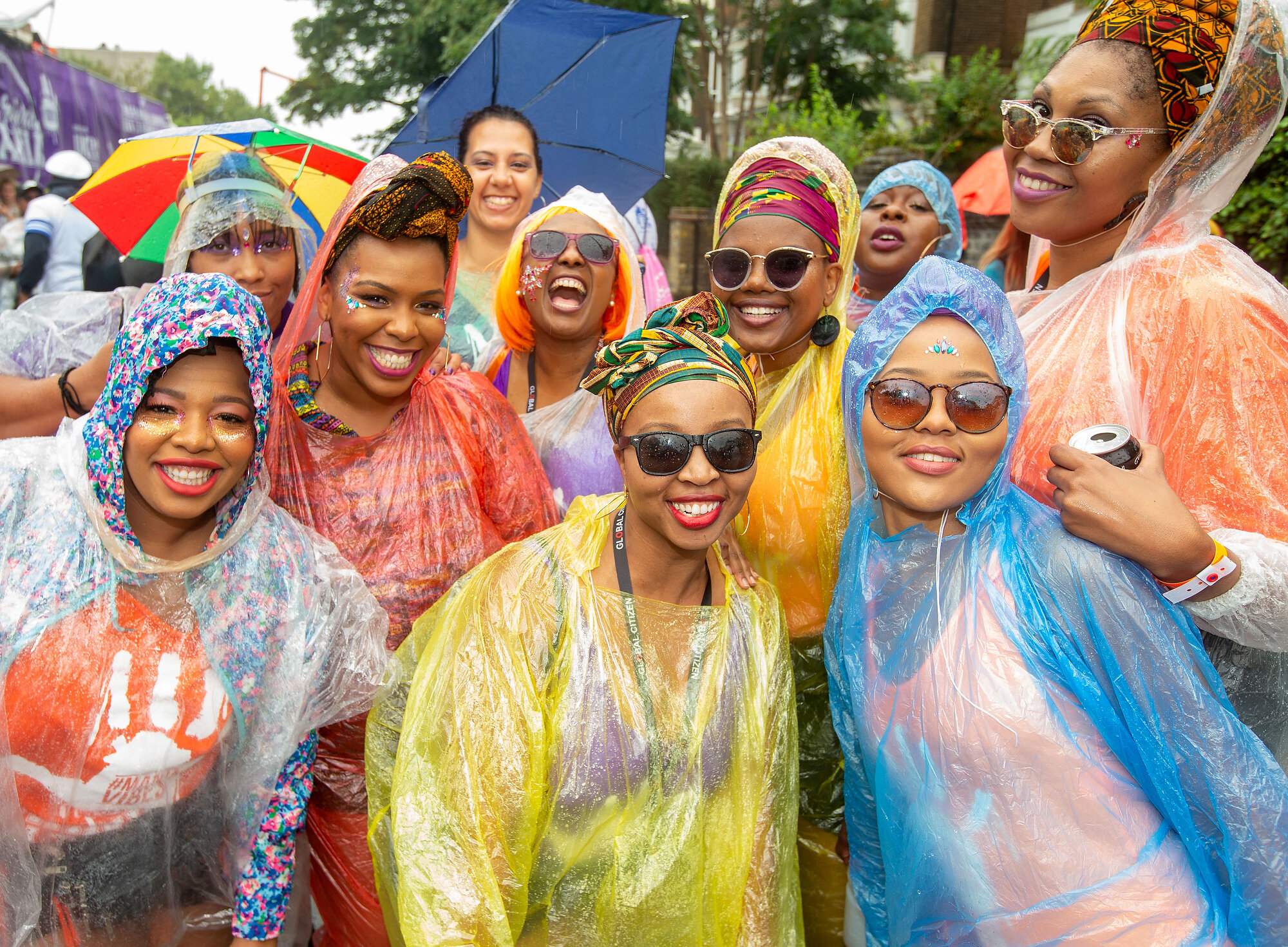  A group of happy revellers pose for a photograph at the end of a wet day at the Notting Hill Carnival. Photo: Mark Thomas, 26 August 2018 