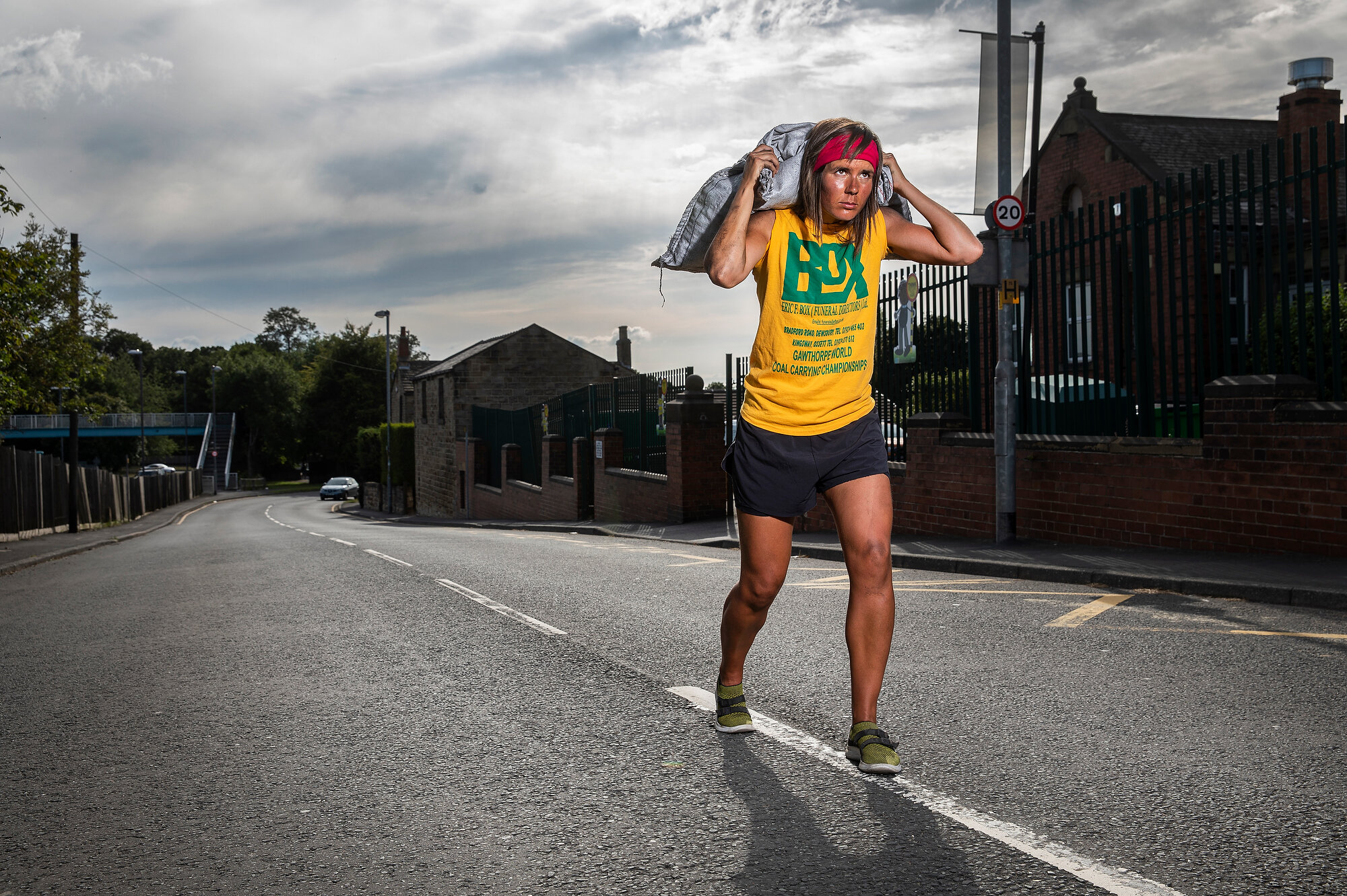  Danielle Sidebottom, the Women’s Gawthorpe World Coal Carrying Champion on the final stretch of the uphill road race by Gawthorpe Primary School where she works as a teacher. Photo: Fabio De Paola, 07 August 2020 