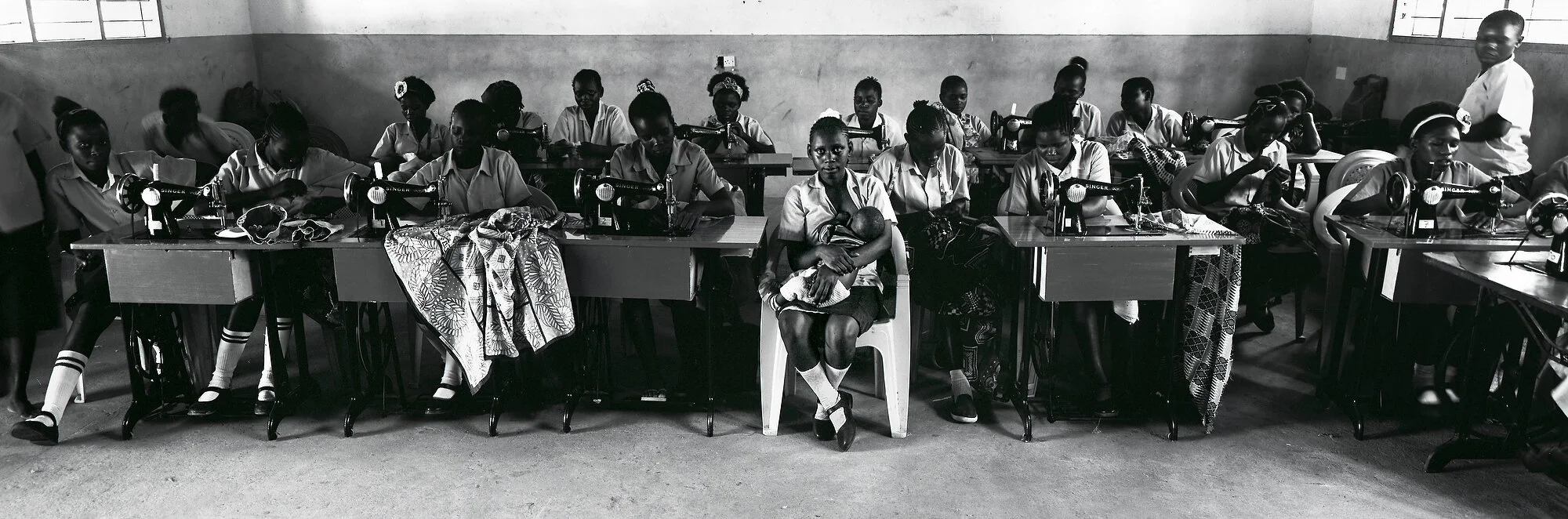  Ruth Sidi Karisa breast feeds her six-month-old son Onesmus at a vocational school in Marafa, Kenya. She gave birth when she was 17 after a relationship with a shop assistant who slipped her treats in exchange for sex before losing interest in her a