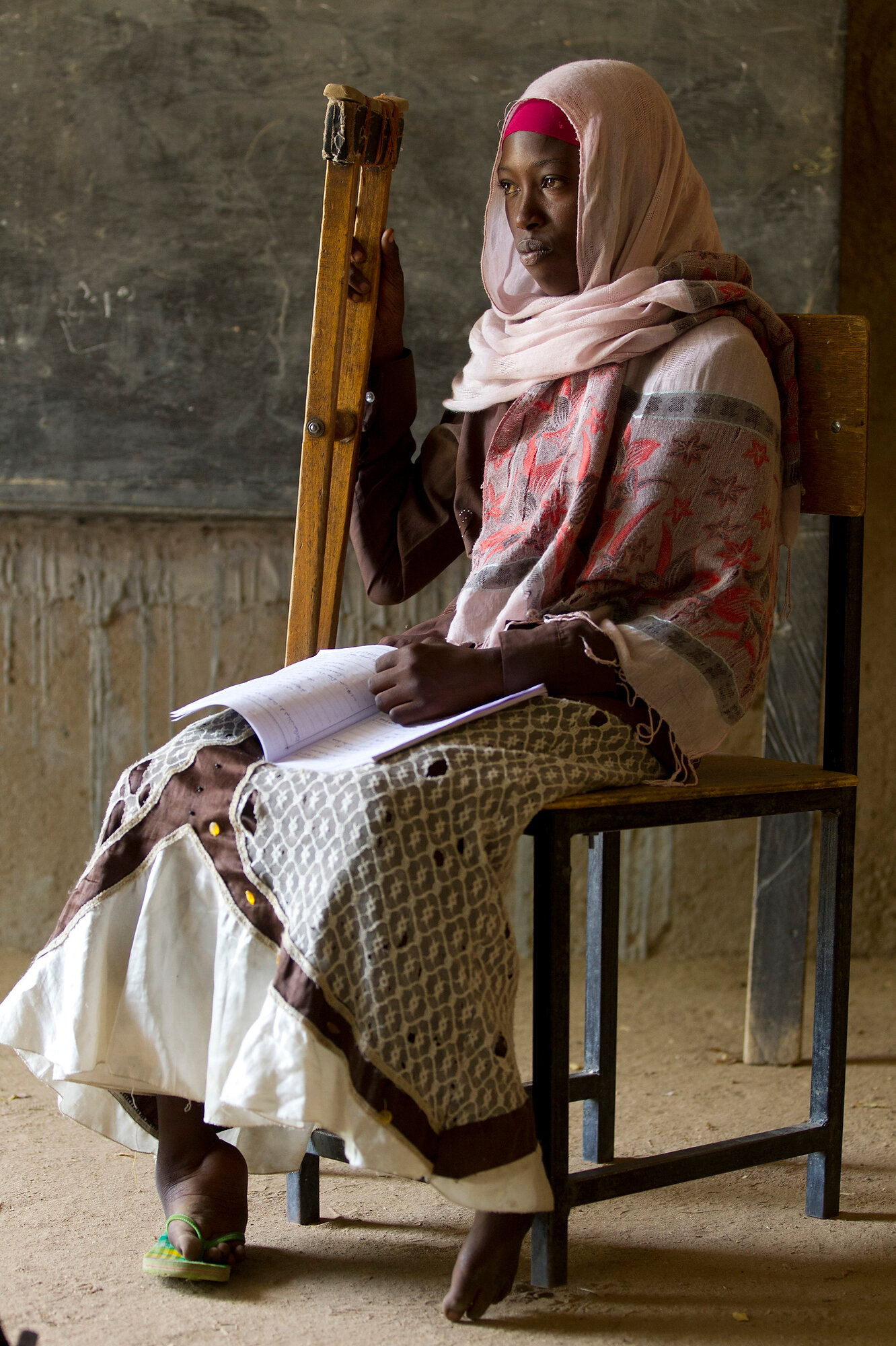  In a remote region in eastern Chad close to the Libyan border, a young girl fights her disability with education. Fifteen year old Fadoul dreams of training to become a teacher.  Photo: Tim Bishop, 24 October 2012 