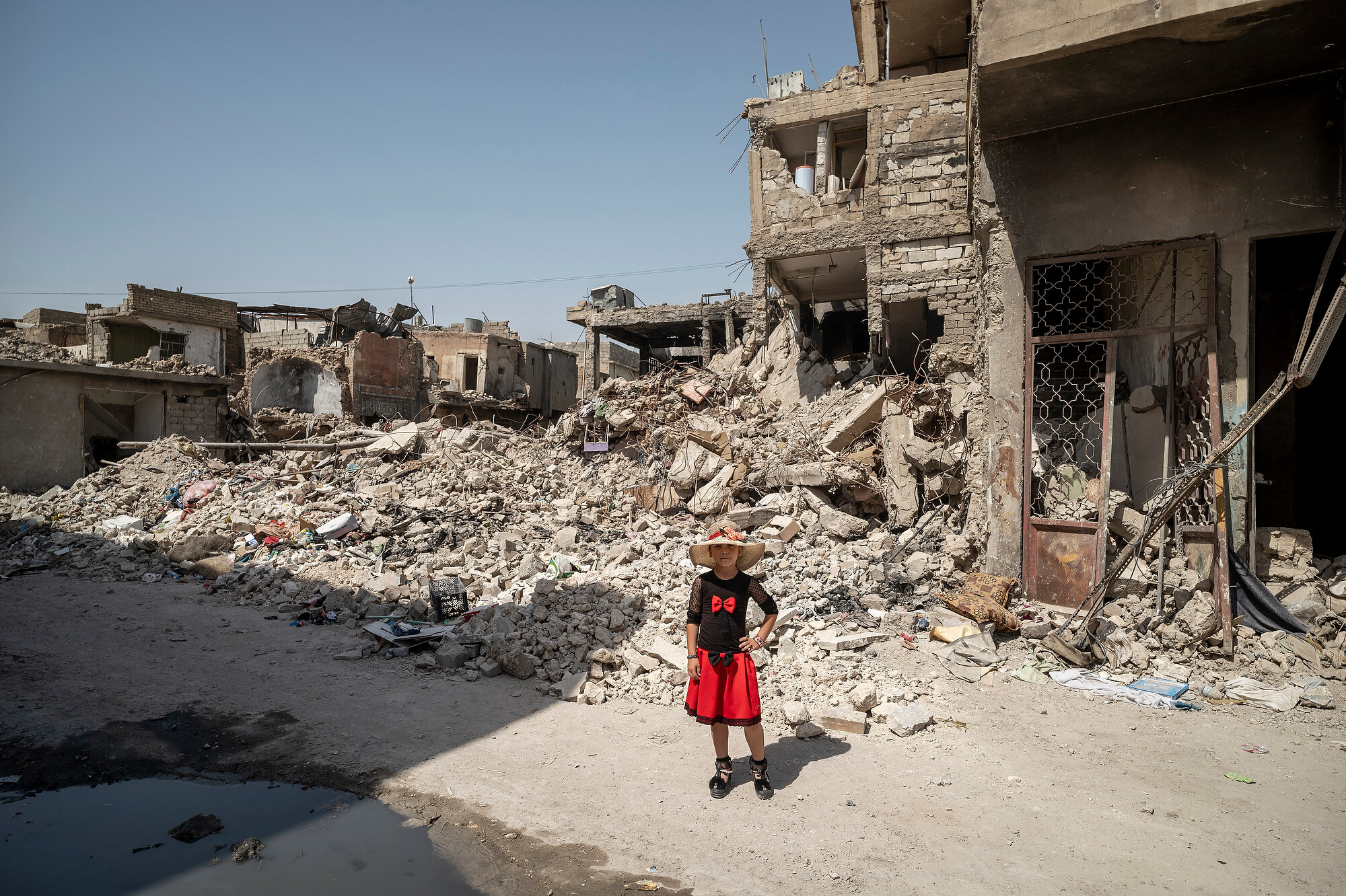  Eight year old Dalal and her family have moved back to their devastated home in the Old City of west Mosul in Iraq. Photo: Philip Coburn/Daily Mirror, 04 July 2018 